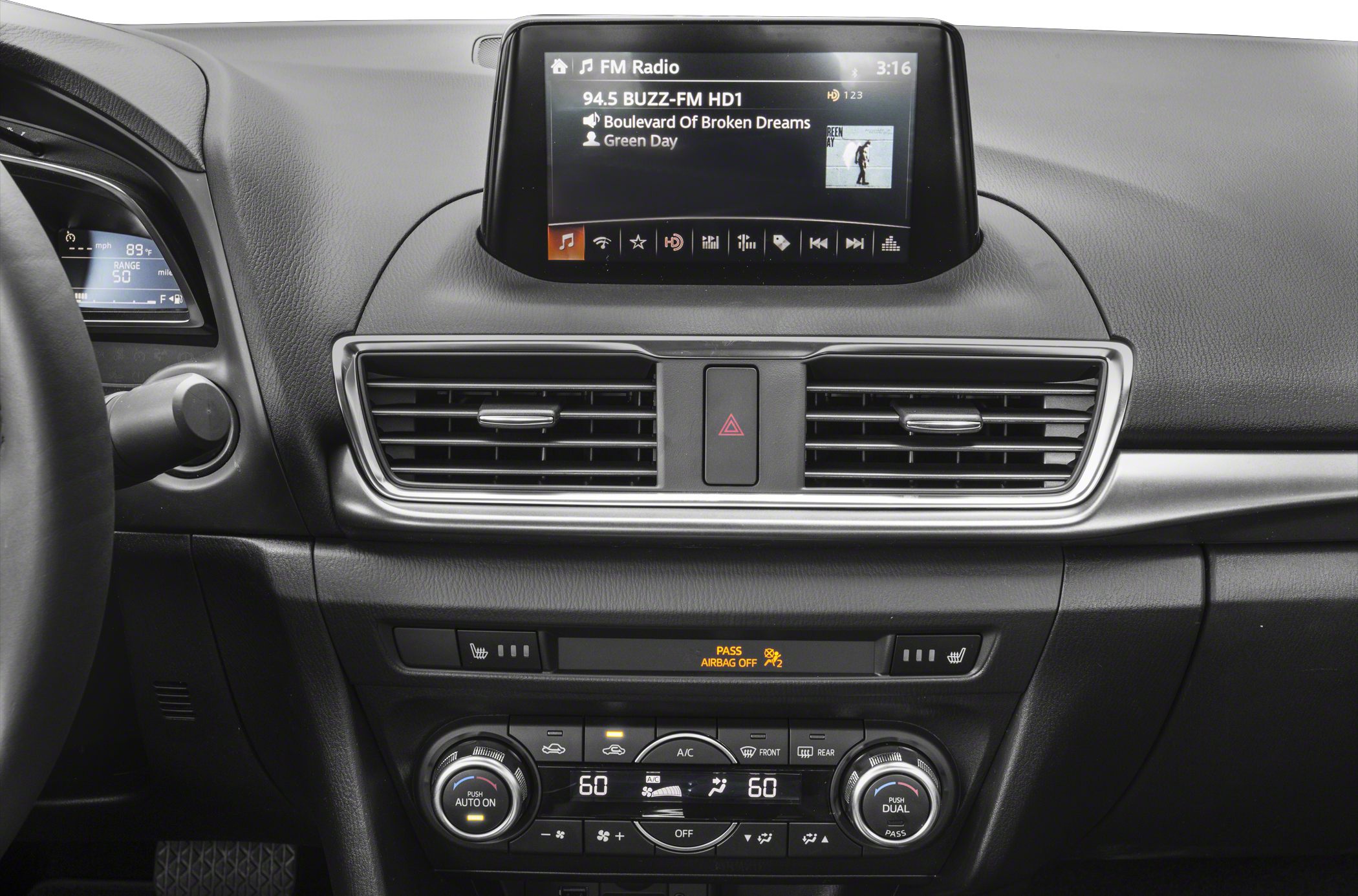 Infotainment screen and dual-zone climate control on dashboard