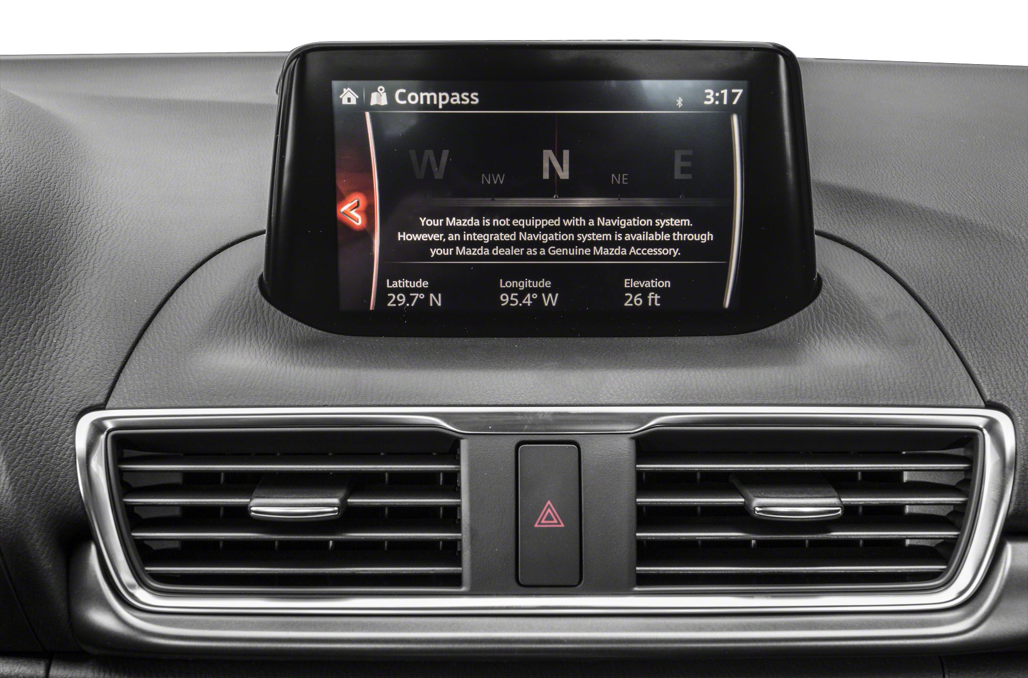 Central dashboard display with compass and dual air vents with hazard button
