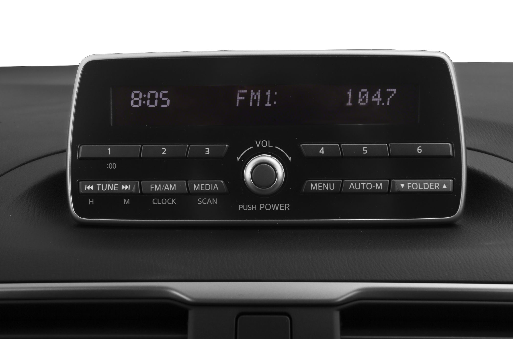 Car radio console with volume knob, FM/AM and media buttons, and preset station controls.