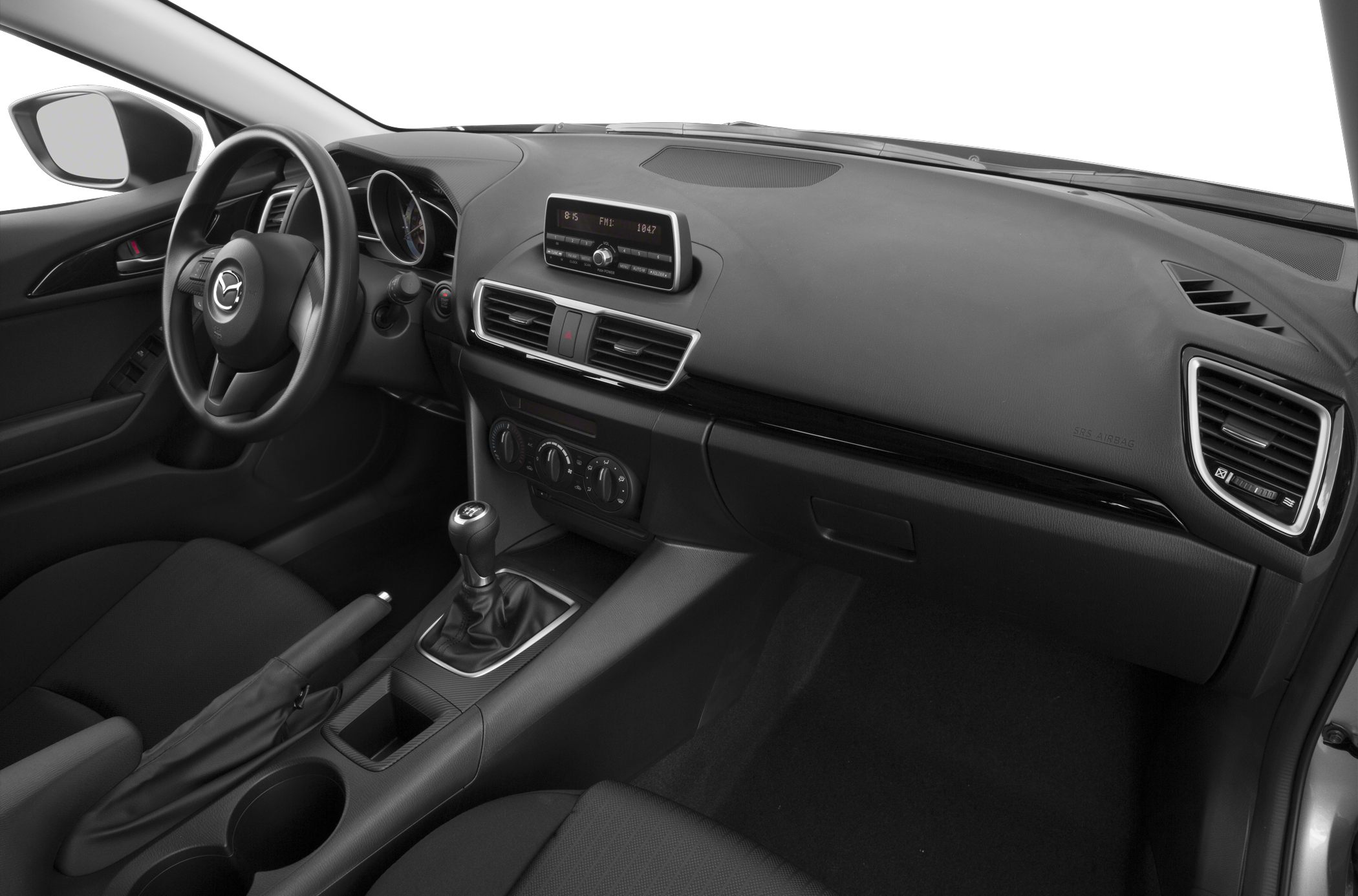 Dashboard, steering wheel, manual gear shift, and center console interior view.