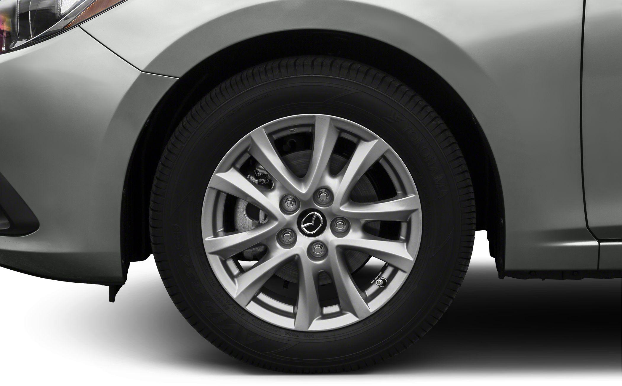 Close-up of alloy wheel and front fender with tire and brake details