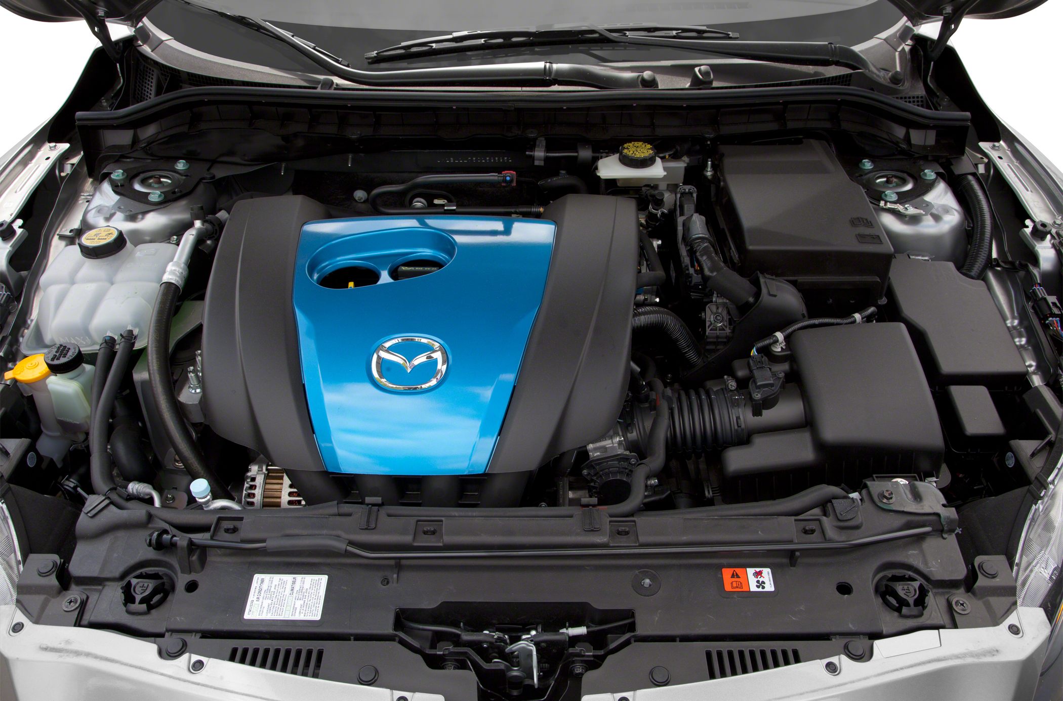 Engine bay with distinctive Mazda engine cover and organized layout