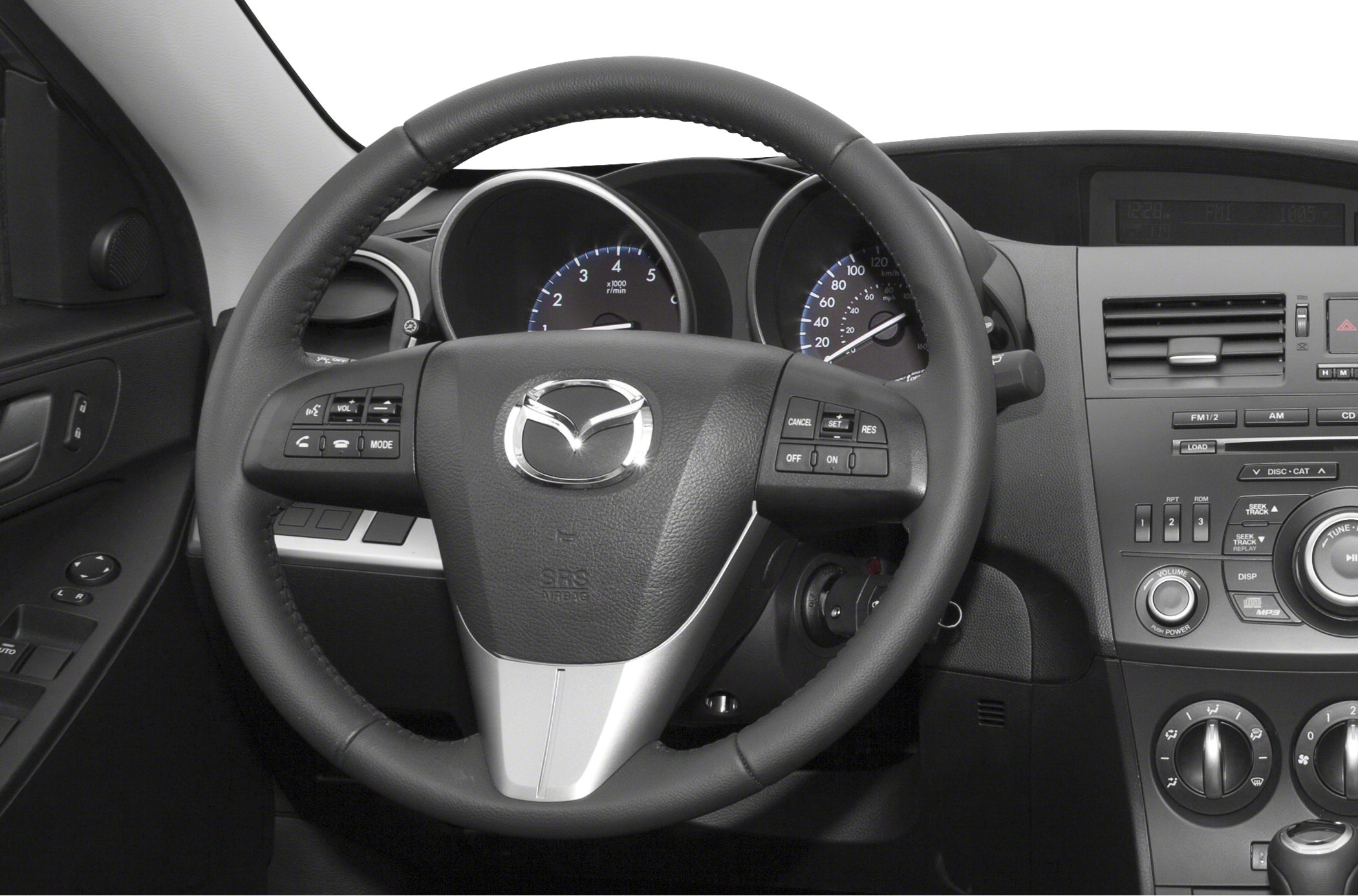 Steering wheel with control buttons and dashboard instrument cluster