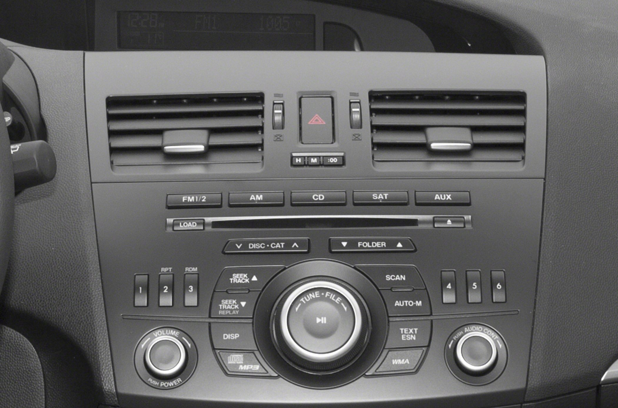 Dashboard audio and climate control panel with vents and buttons