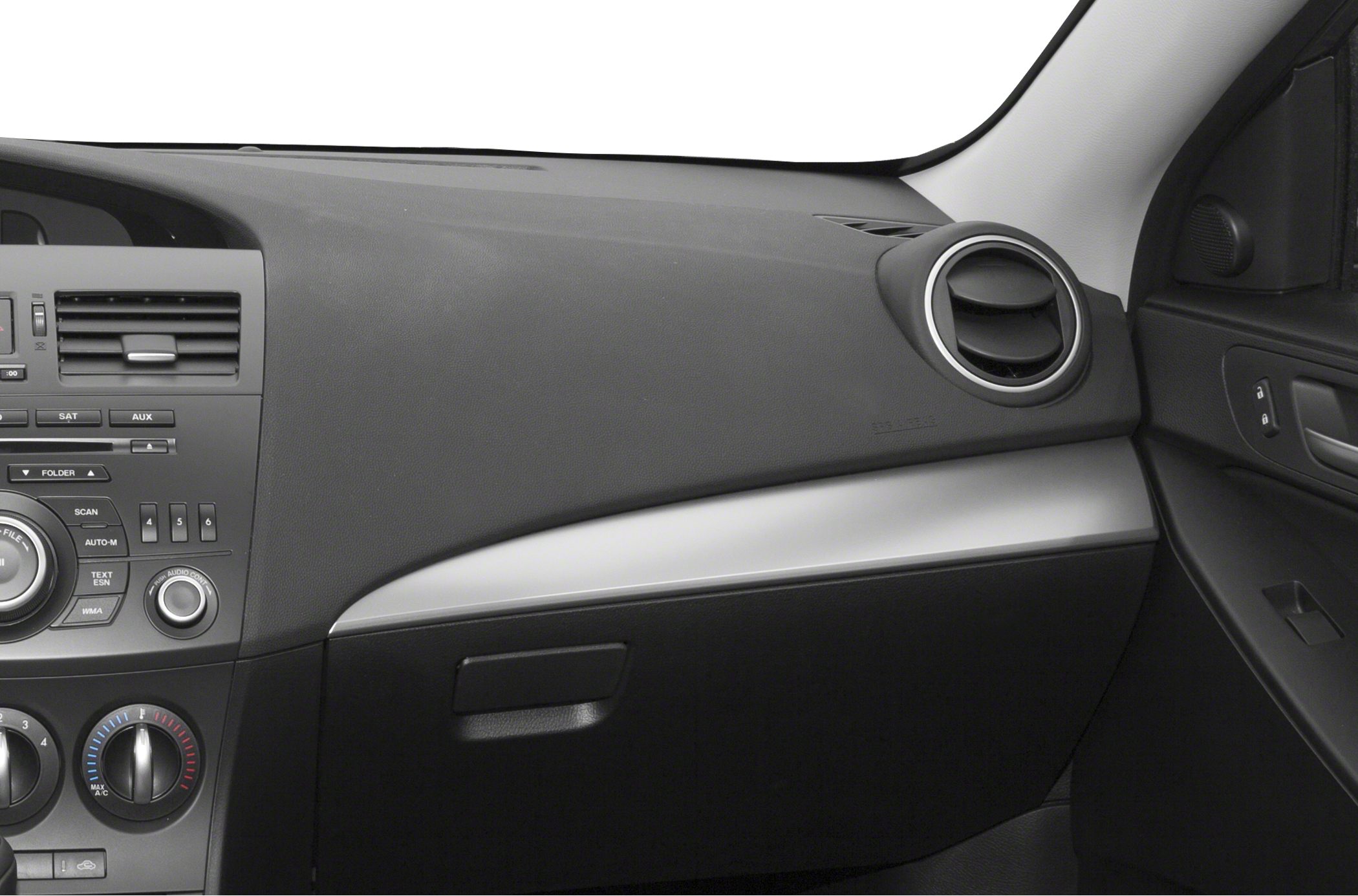 Dashboard with circular air vent and control panel with climate and audio dials