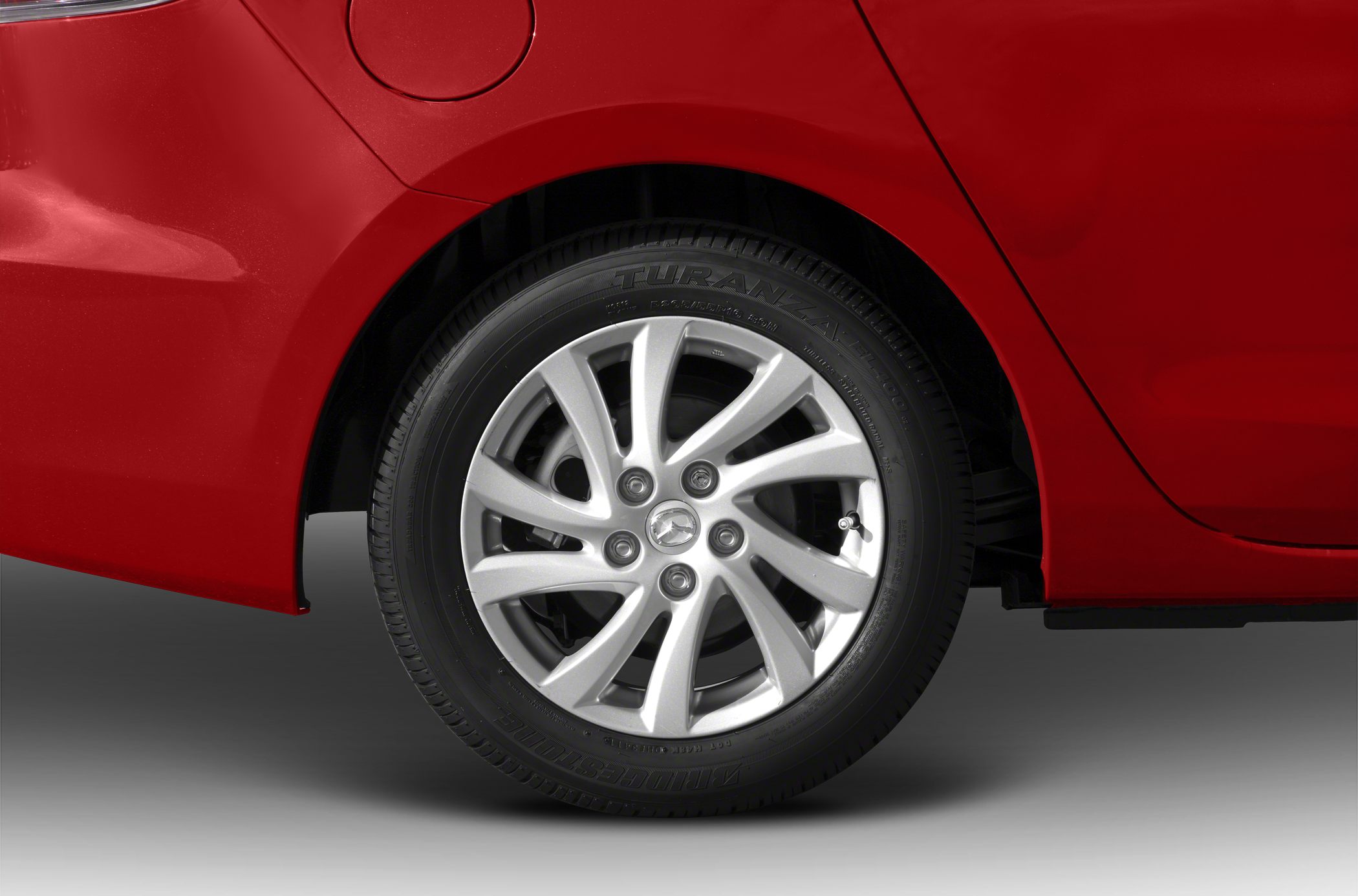Rear alloy wheel and tire close-up of a sedan