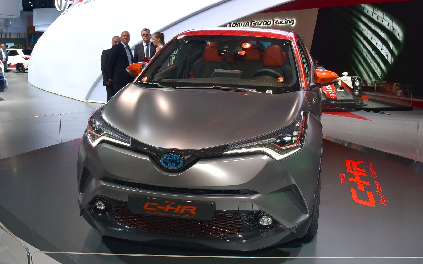 Futuristic front fascia with sharp LED headlights and aggressive grille.