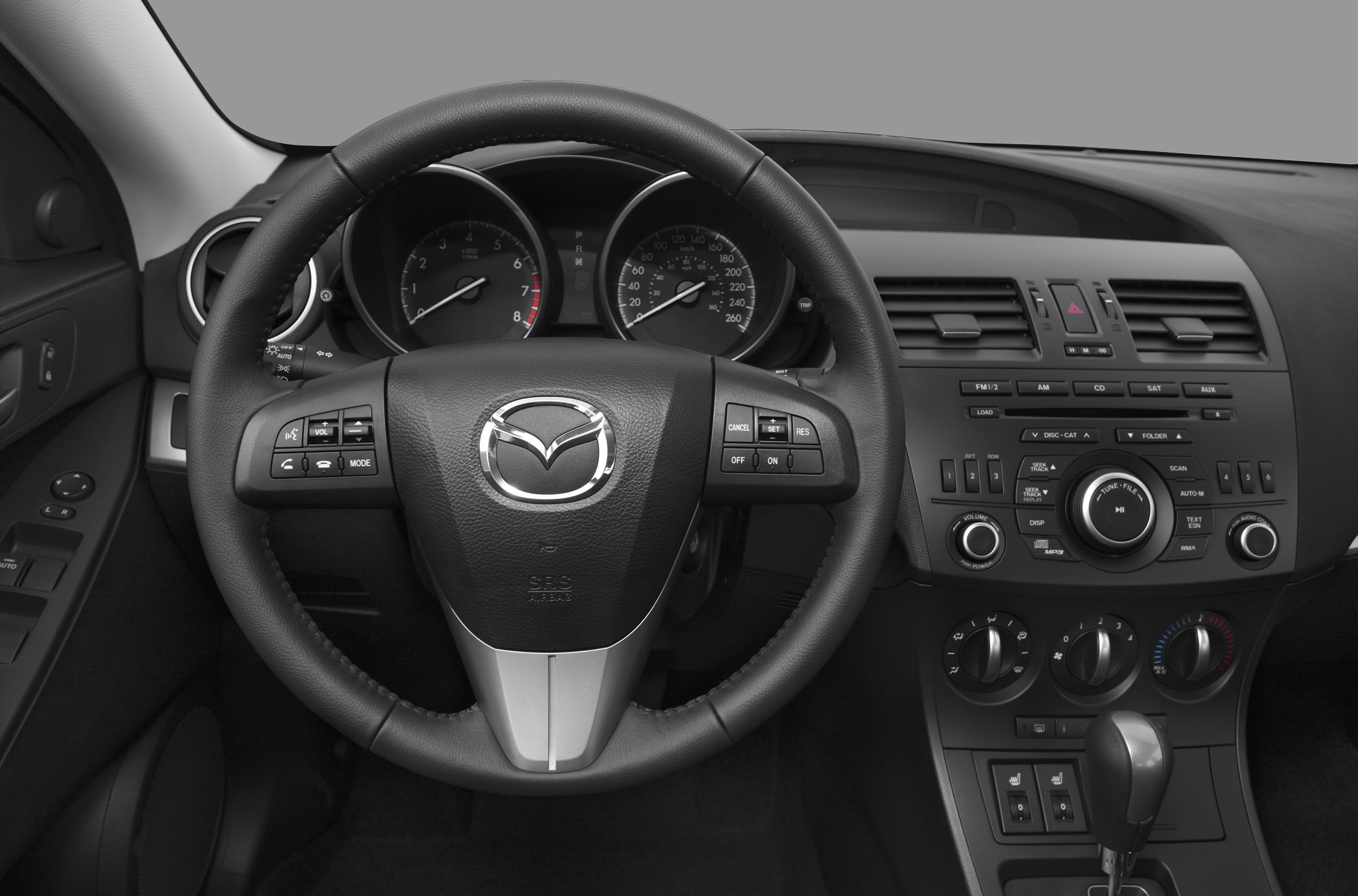 Steering wheel, instrument cluster, and dashboard controls