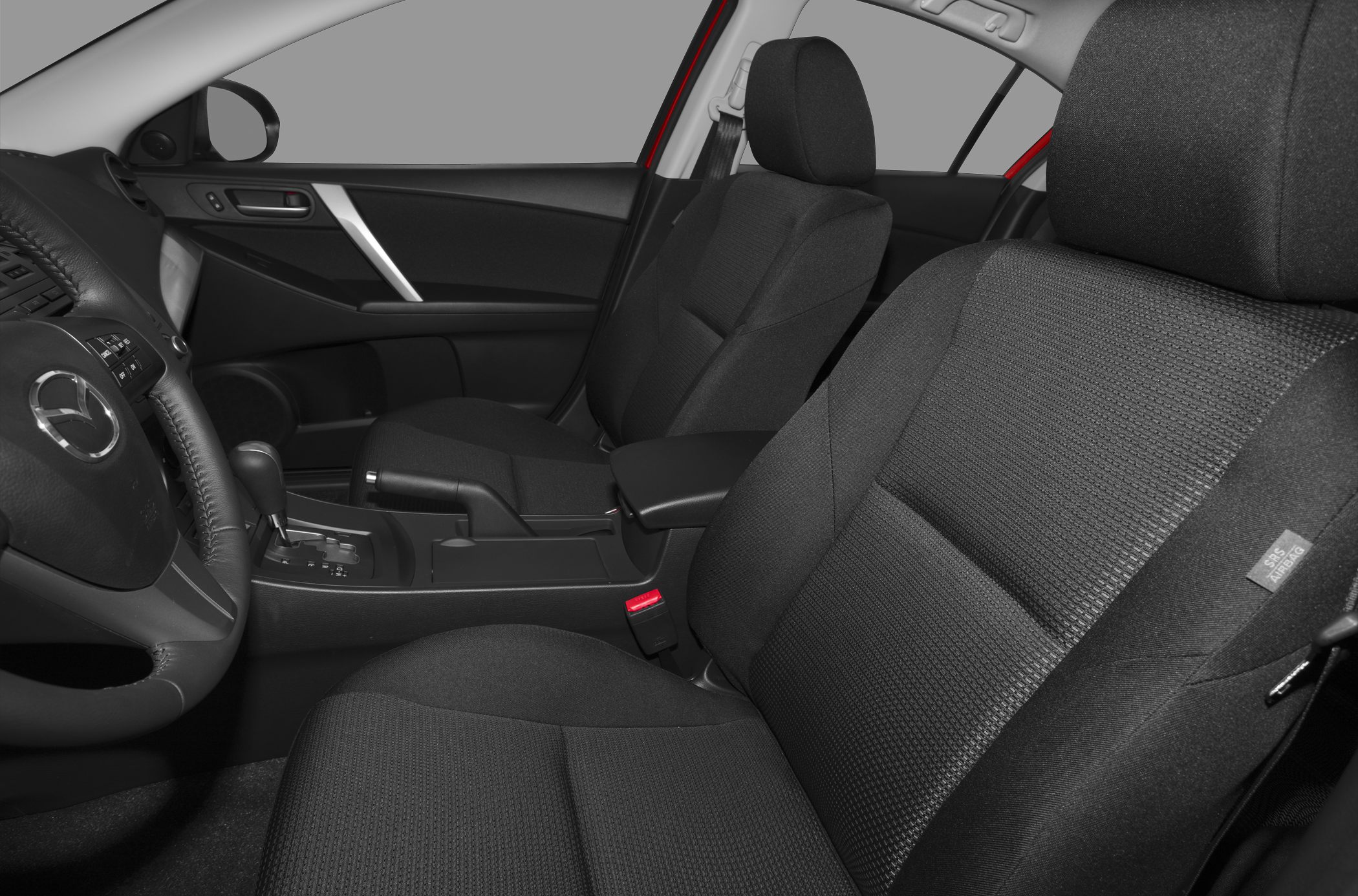 Fabric front seats and dashboard with steering wheel in a car interior