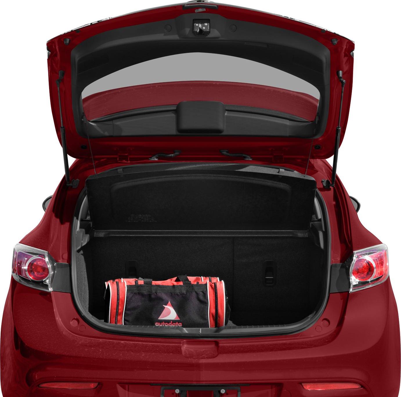 Open hatchback trunk with cargo cover and a bag inside