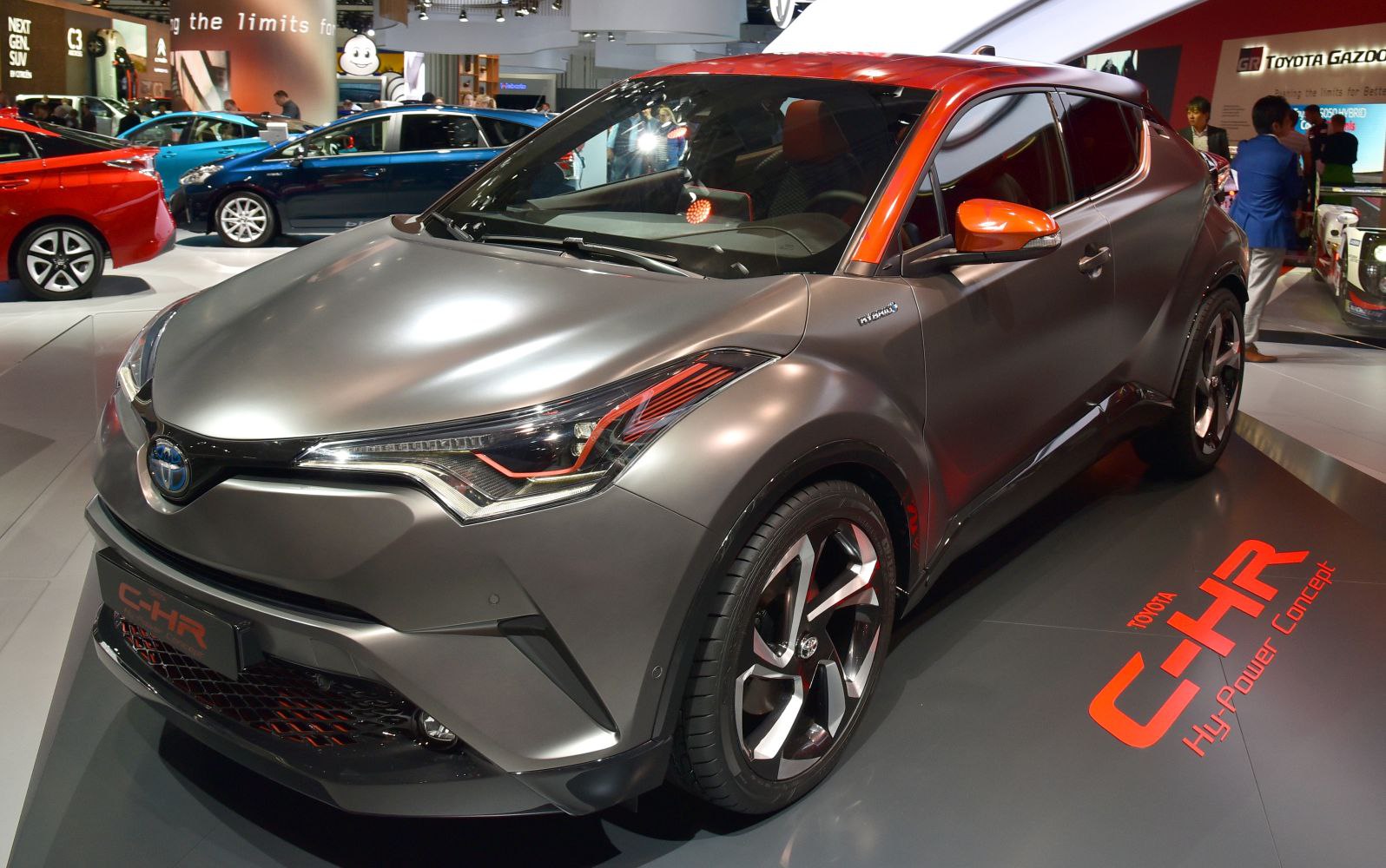 Matte gray and orange two-tone SUV with sharp LED headlights