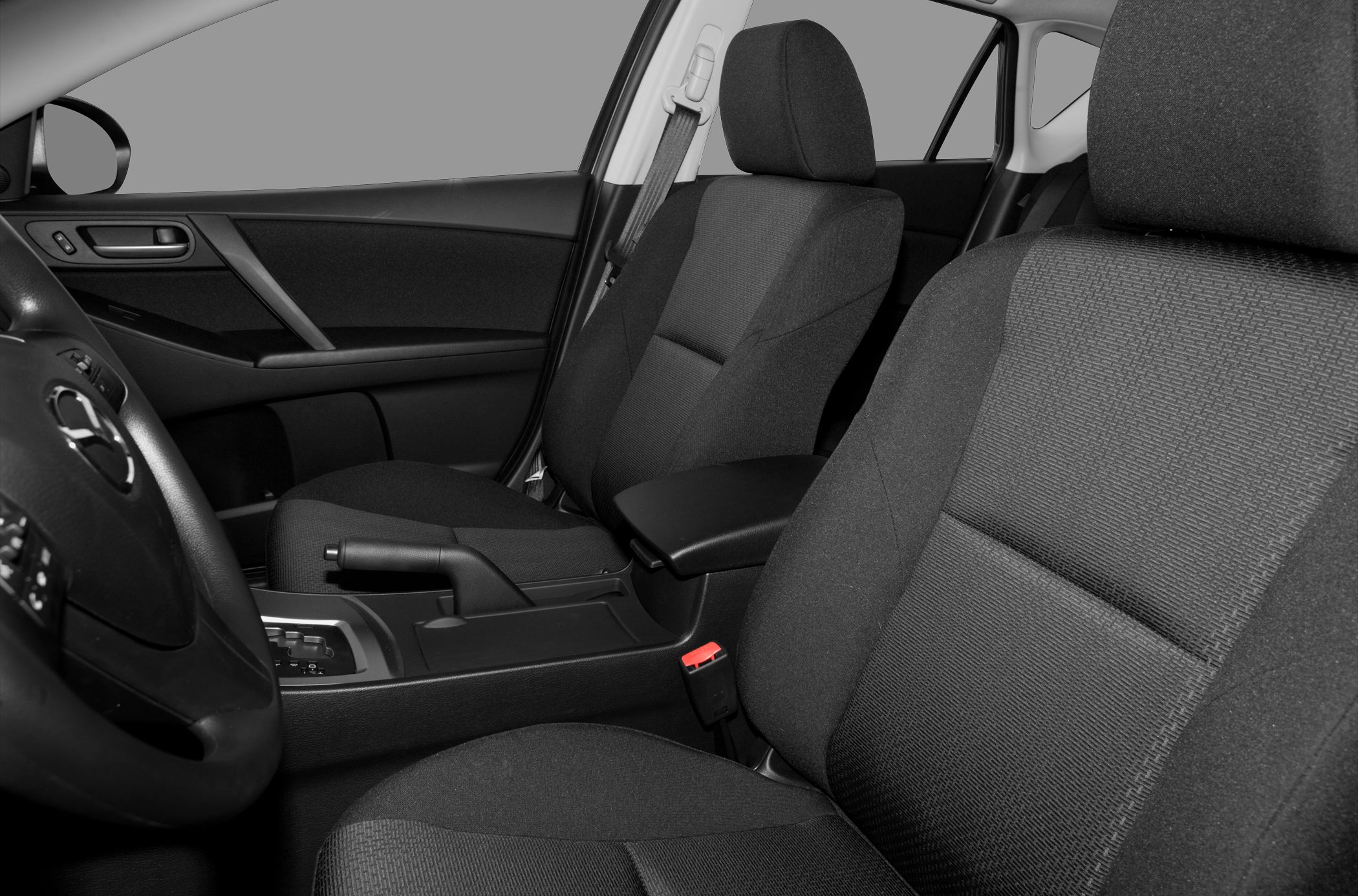 Close-up of car front seats and central armrest with detailed upholstery