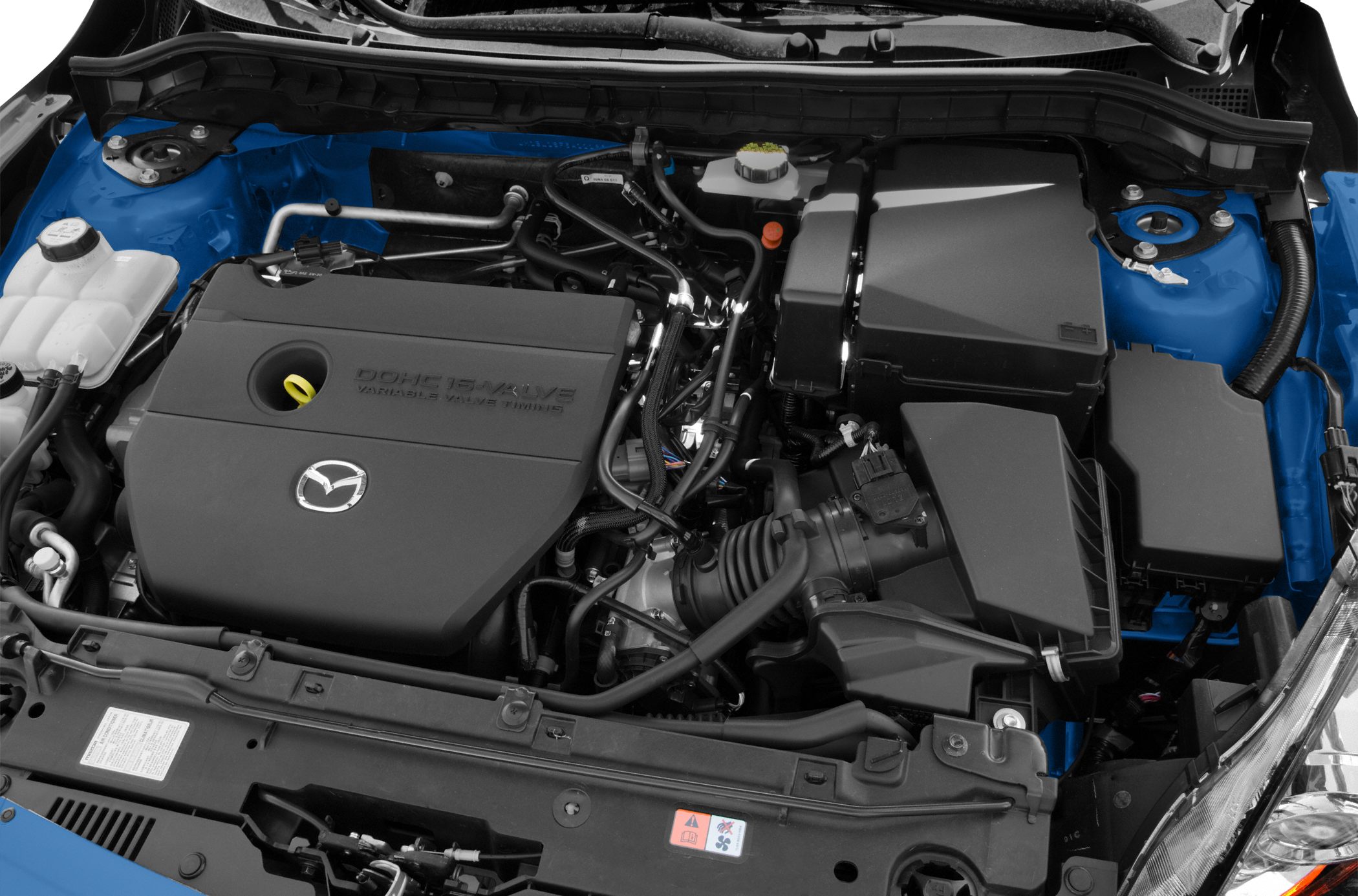 Close-up of engine compartment with DOHC 16-valve VVT and air intake system.