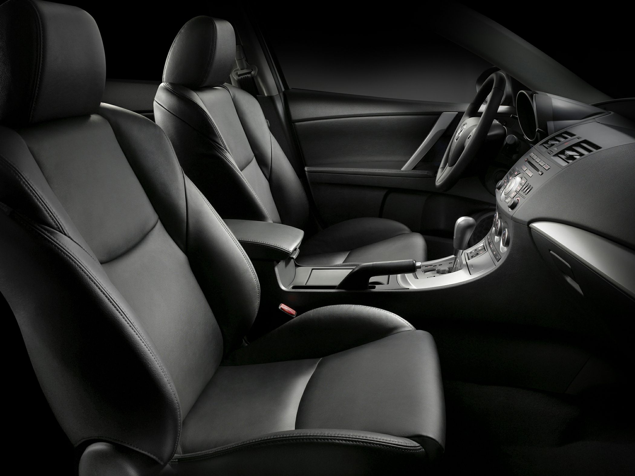 Black leather seats with center console and dashboard controls