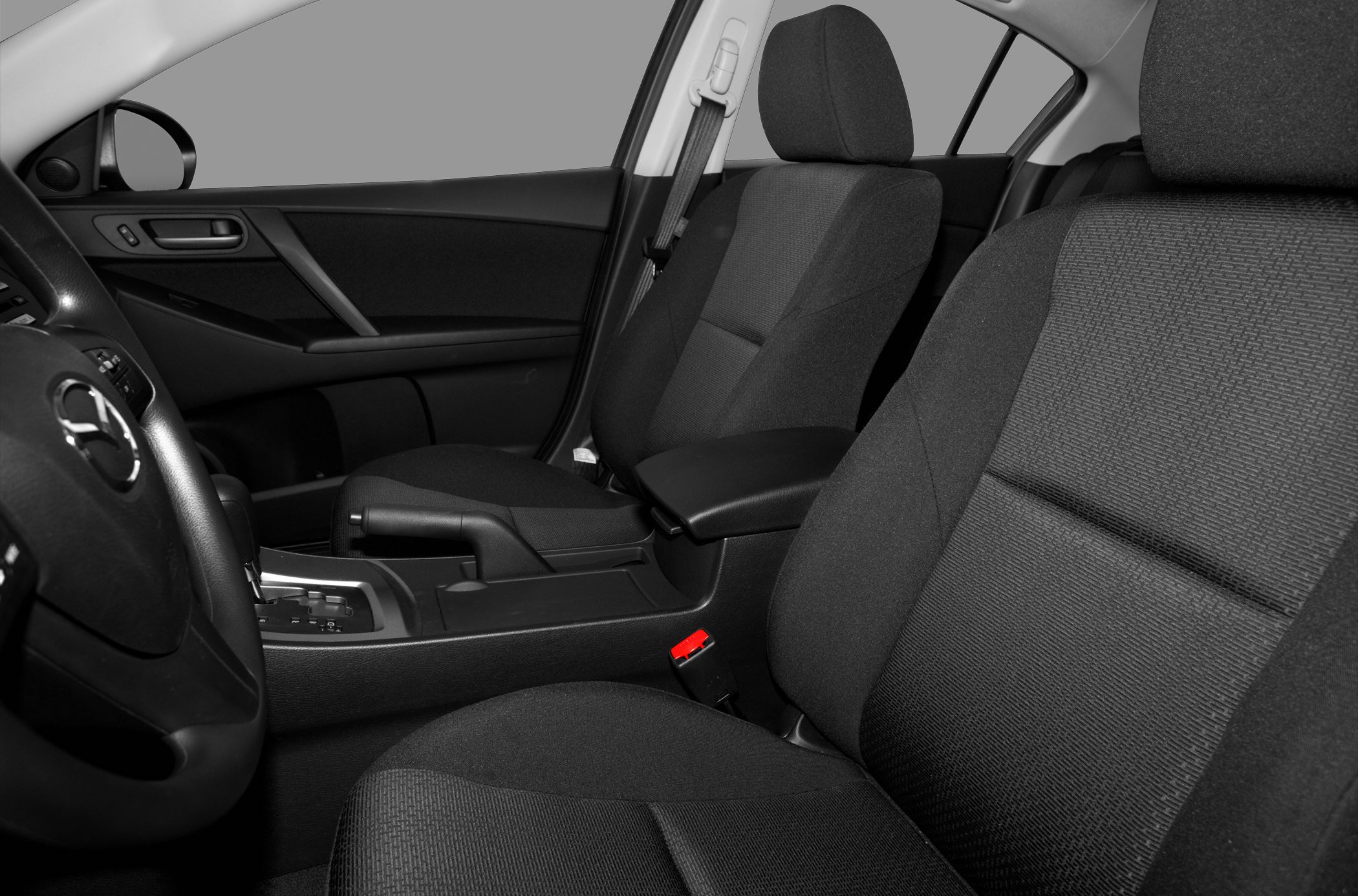 Fabric seats and center console with handbrake and armrest