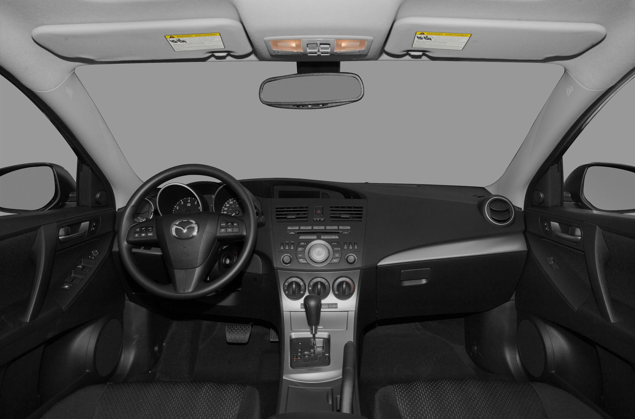 Dashboard and steering wheel with center console featuring controls and gear shift