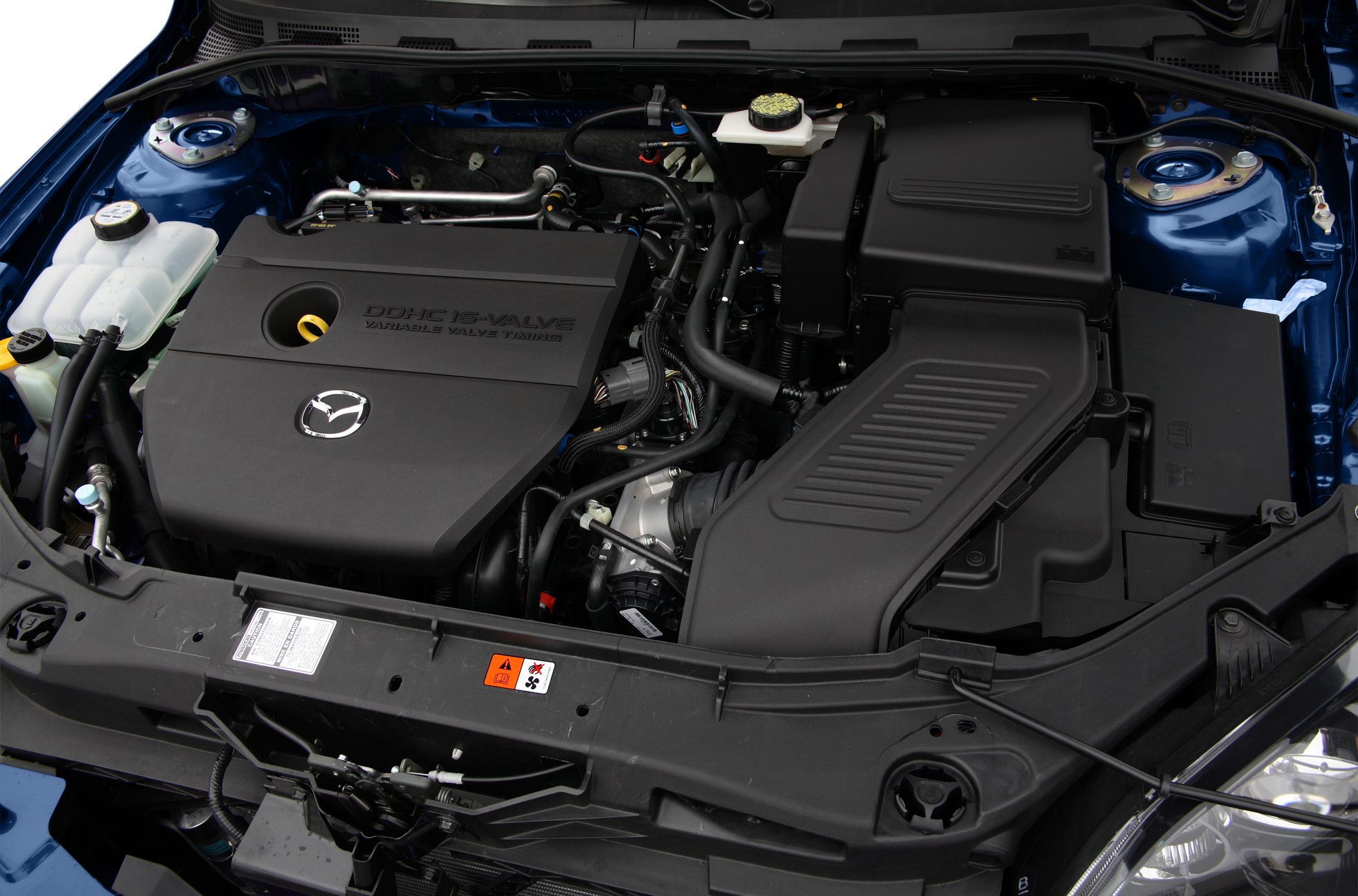 Engine bay with DOHC 16-valve and Mazda logo