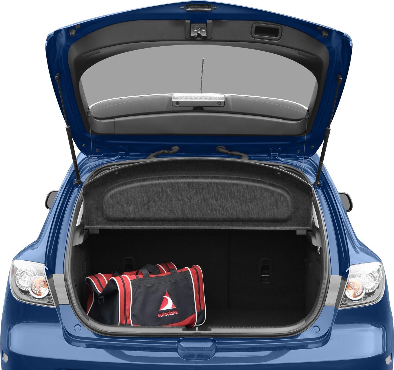 Open hatchback trunk with cargo cover and bag inside