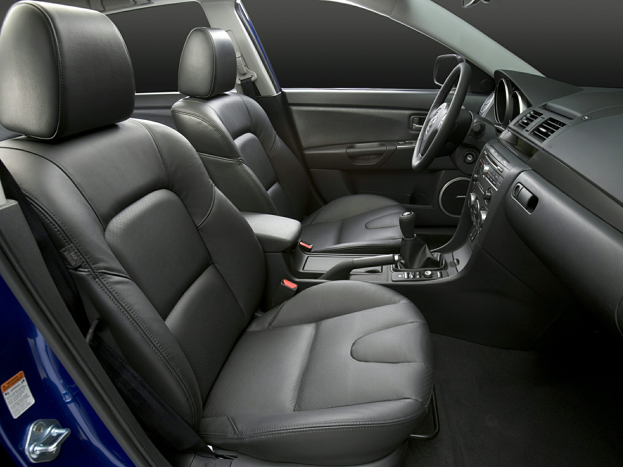 Black leather seats and modern dashboard with manual transmission