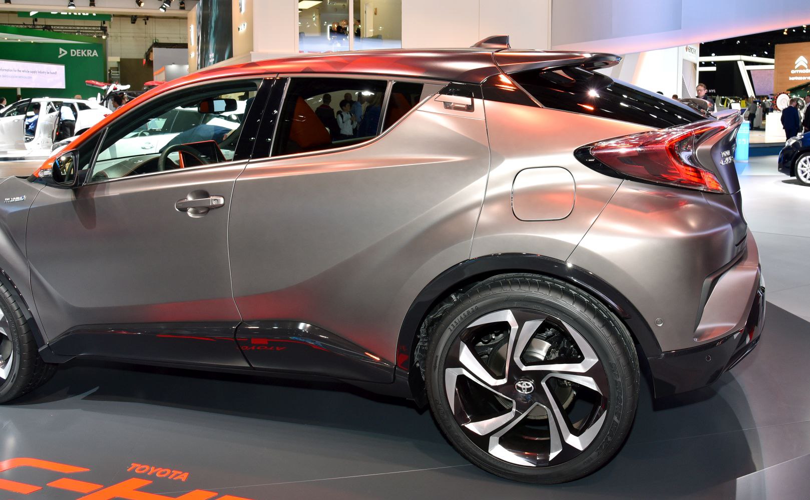 Side profile with angular rear taillights and futuristic alloy wheels