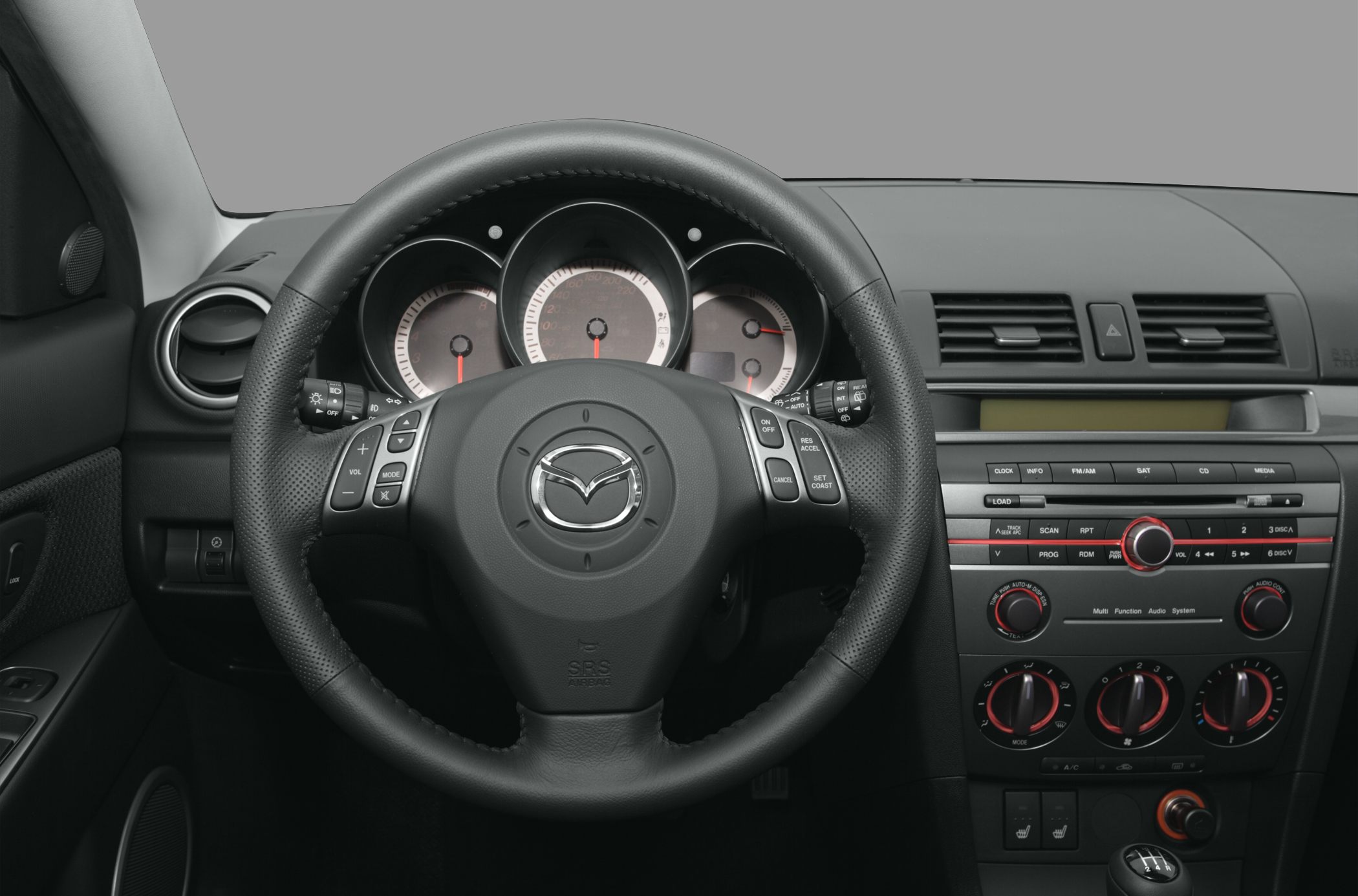 Steering wheel, instrument cluster, center console, and gear shifter in car interior
