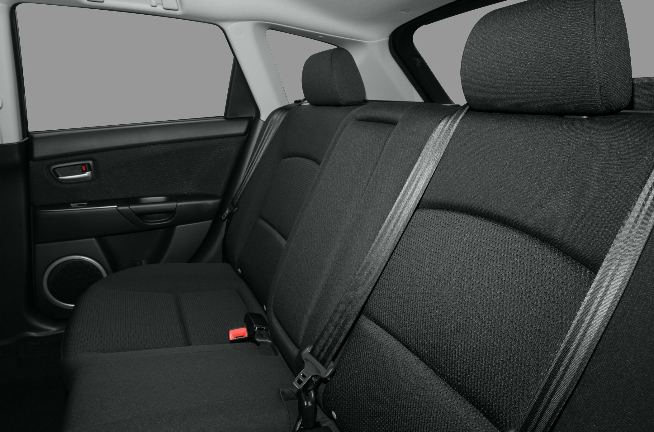 Rear fabric seats and seatbelt in a hatchback interior