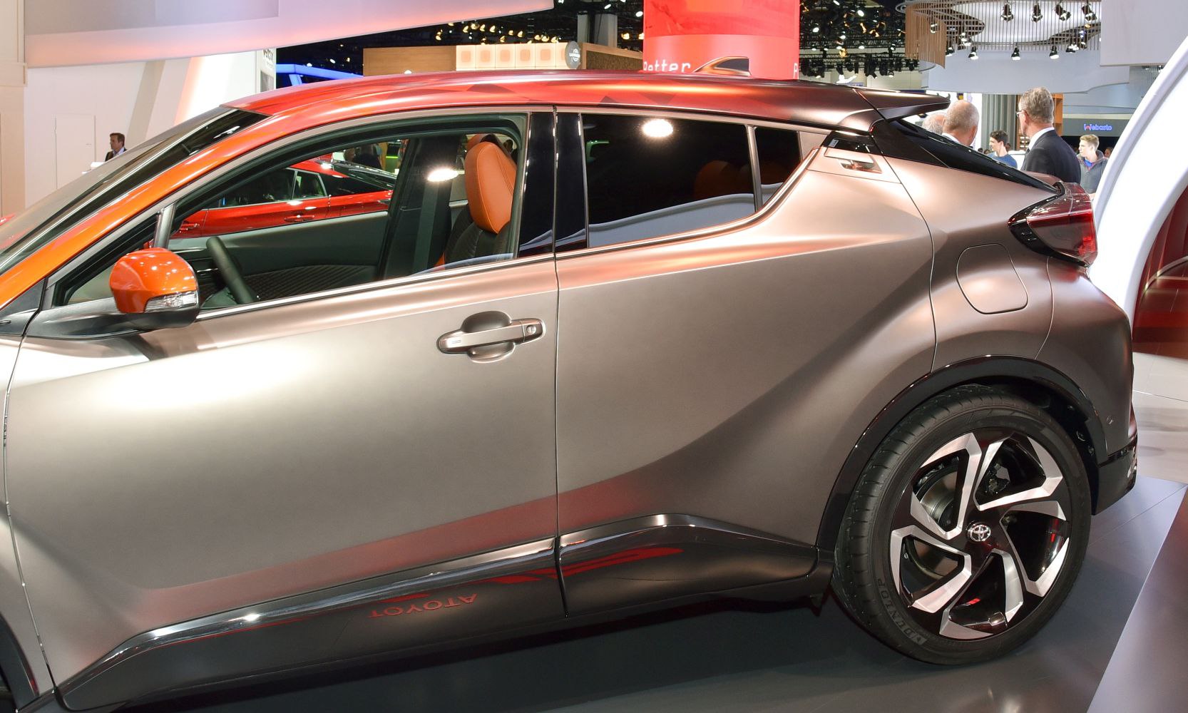 Side profile with aerodynamic body lines and distinct alloy wheel.