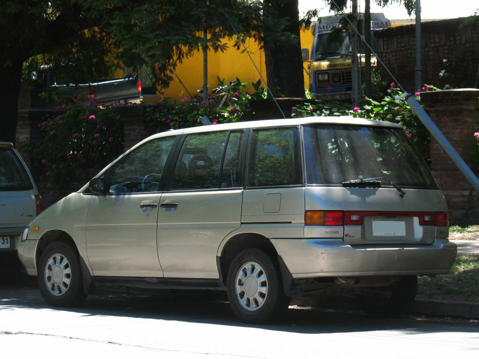 Minivan side and rear view with boxy design and large windows