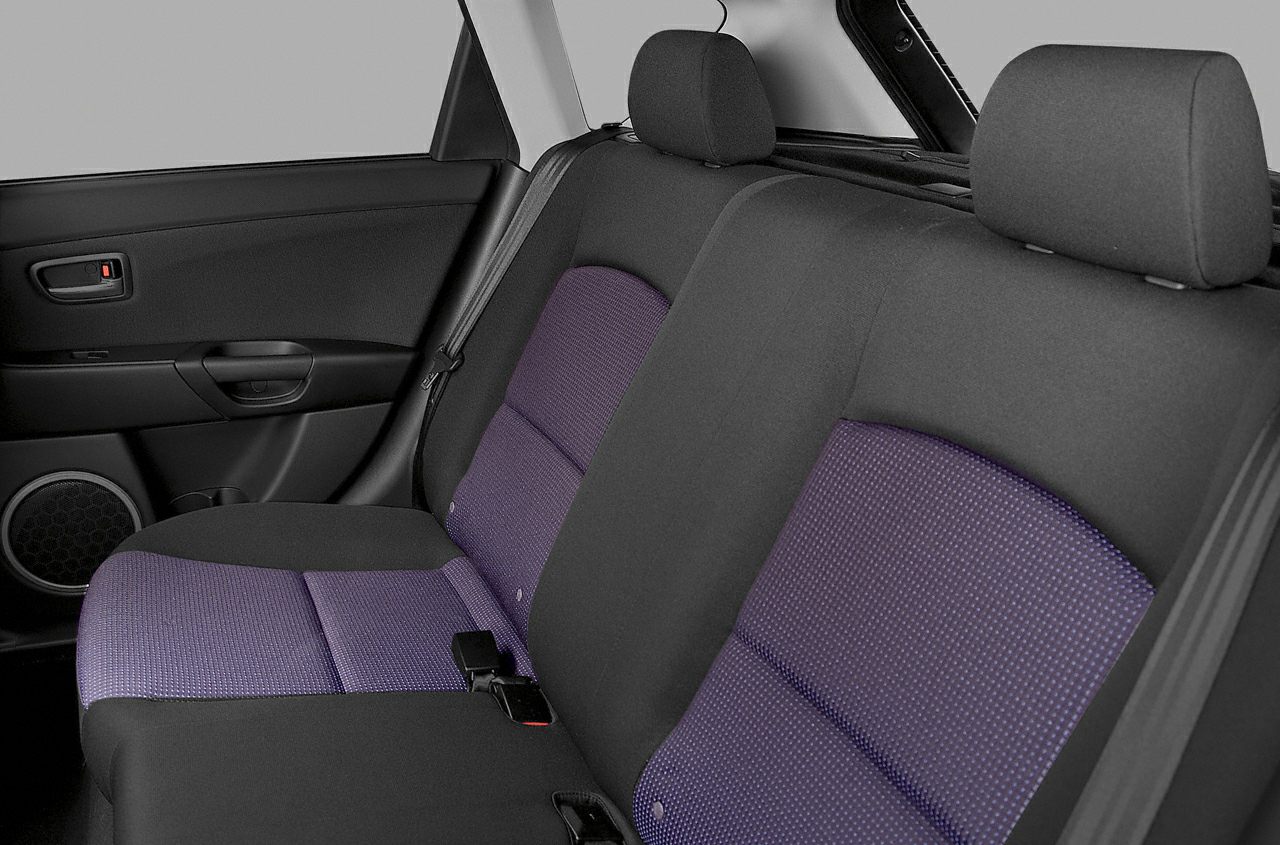 Rear car seats with fabric upholstery in purple and black