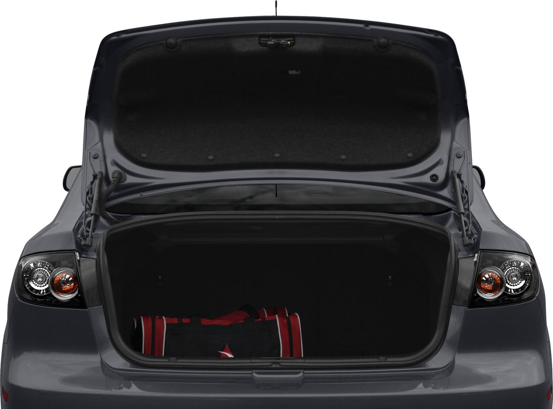 Open trunk with visible tail lights and storage space in rear sedan view