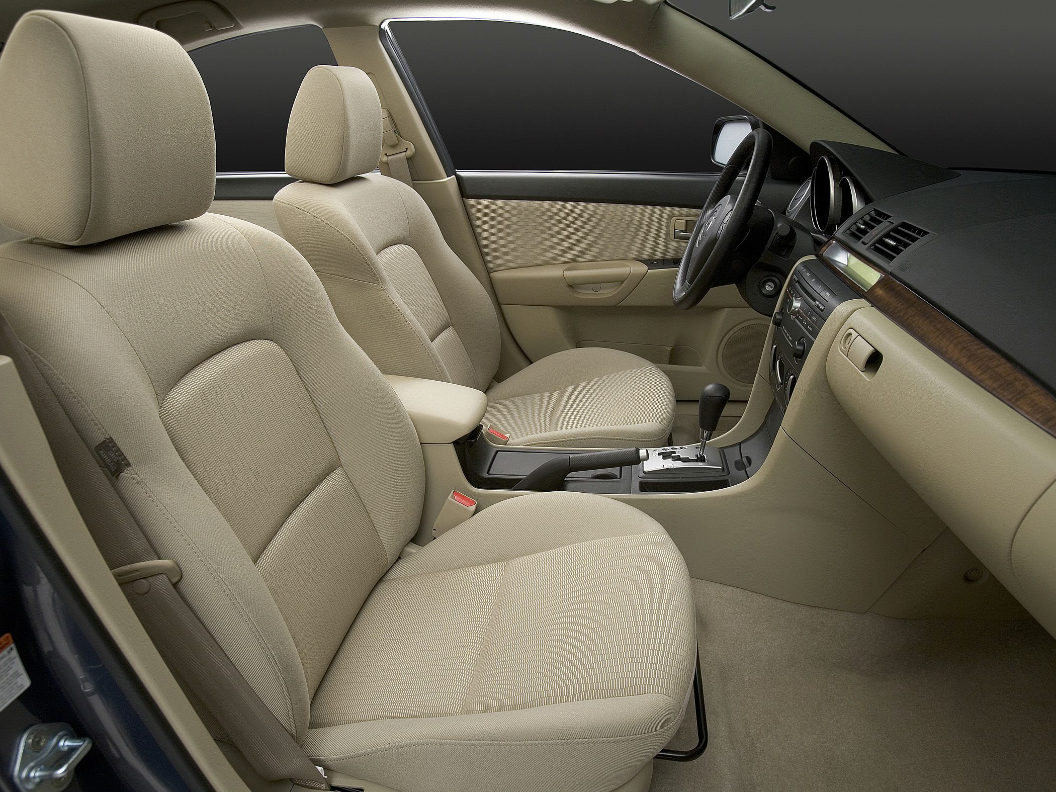 Beige fabric front seats with dashboard and automatic gear selector