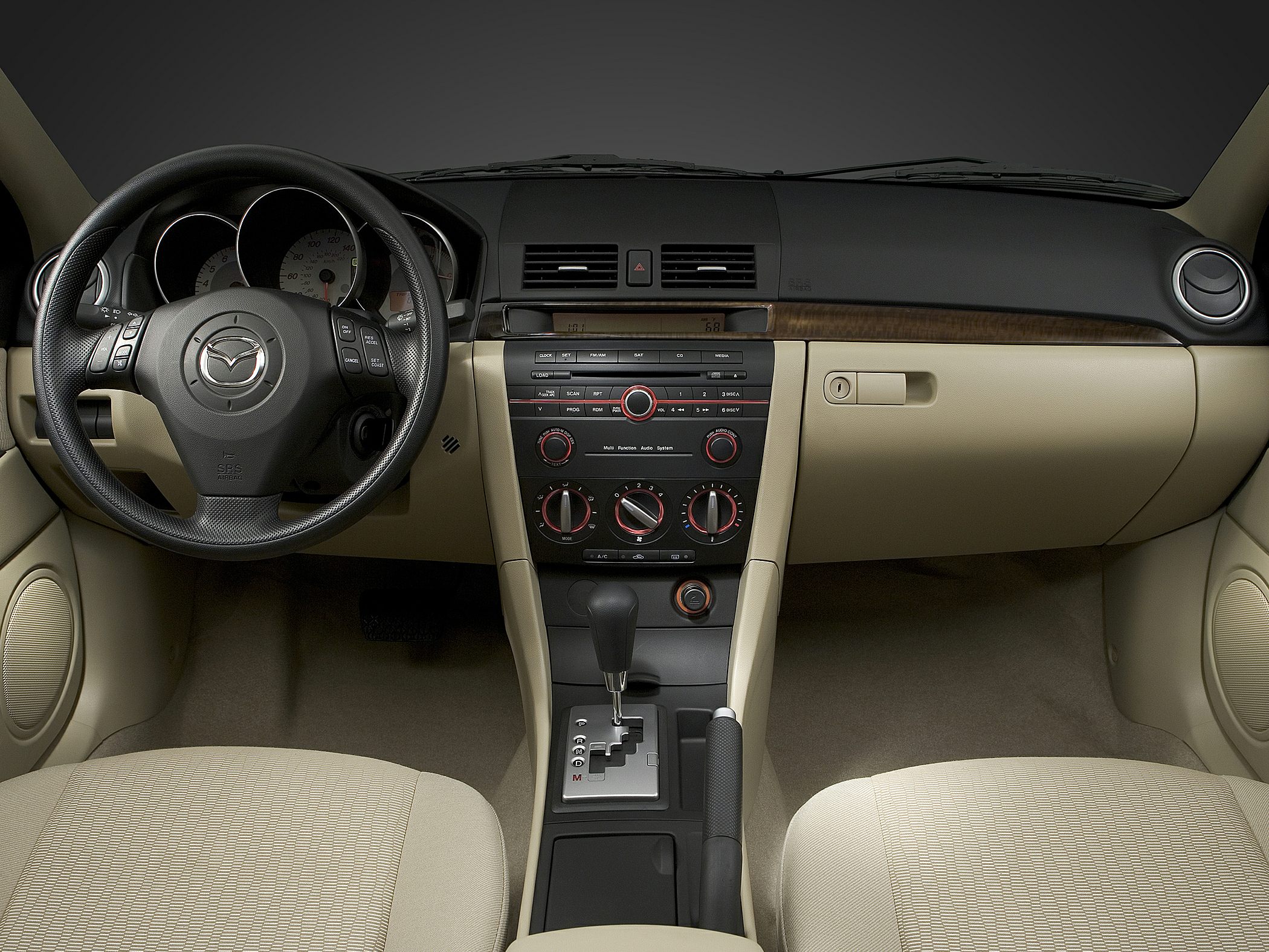 Interior dashboard with multifunction steering wheel and center console controls