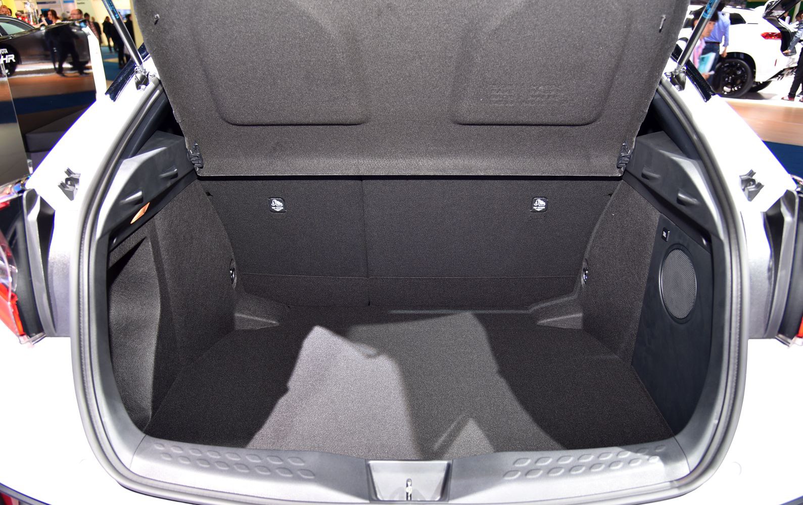 Spacious car trunk interior with foldable rear seats and speaker system
