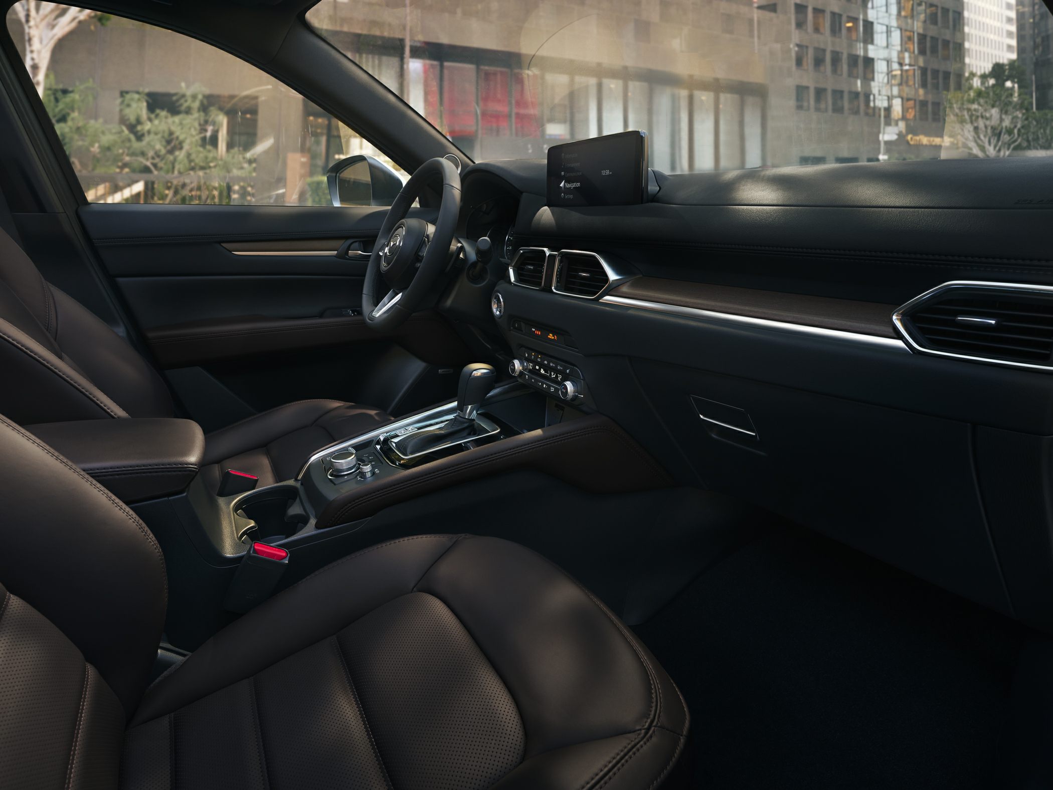 Modern dashboard and center console with infotainment screen and premium seats