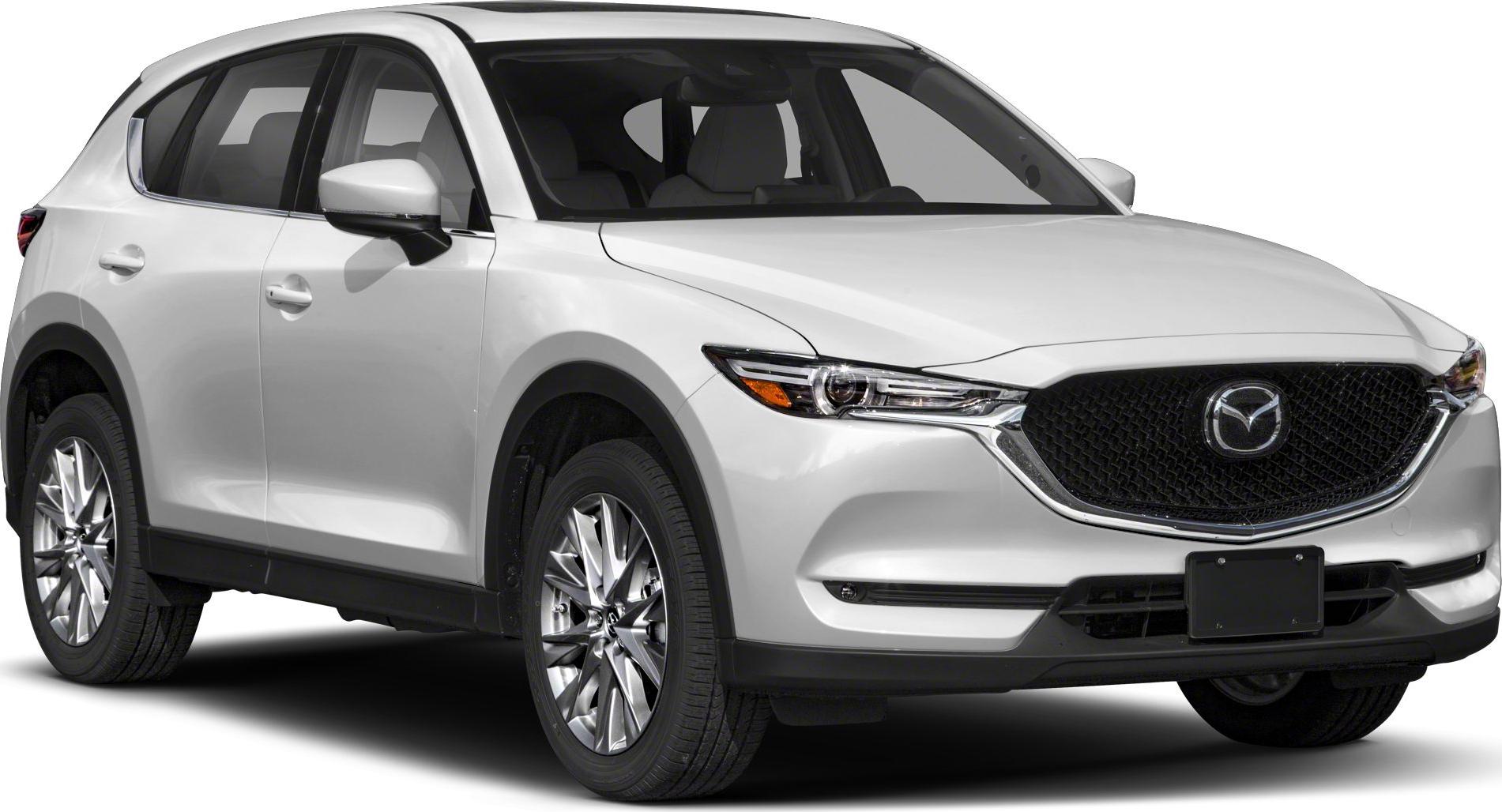 Front side view of white SUV with sleek headlights and alloy wheels