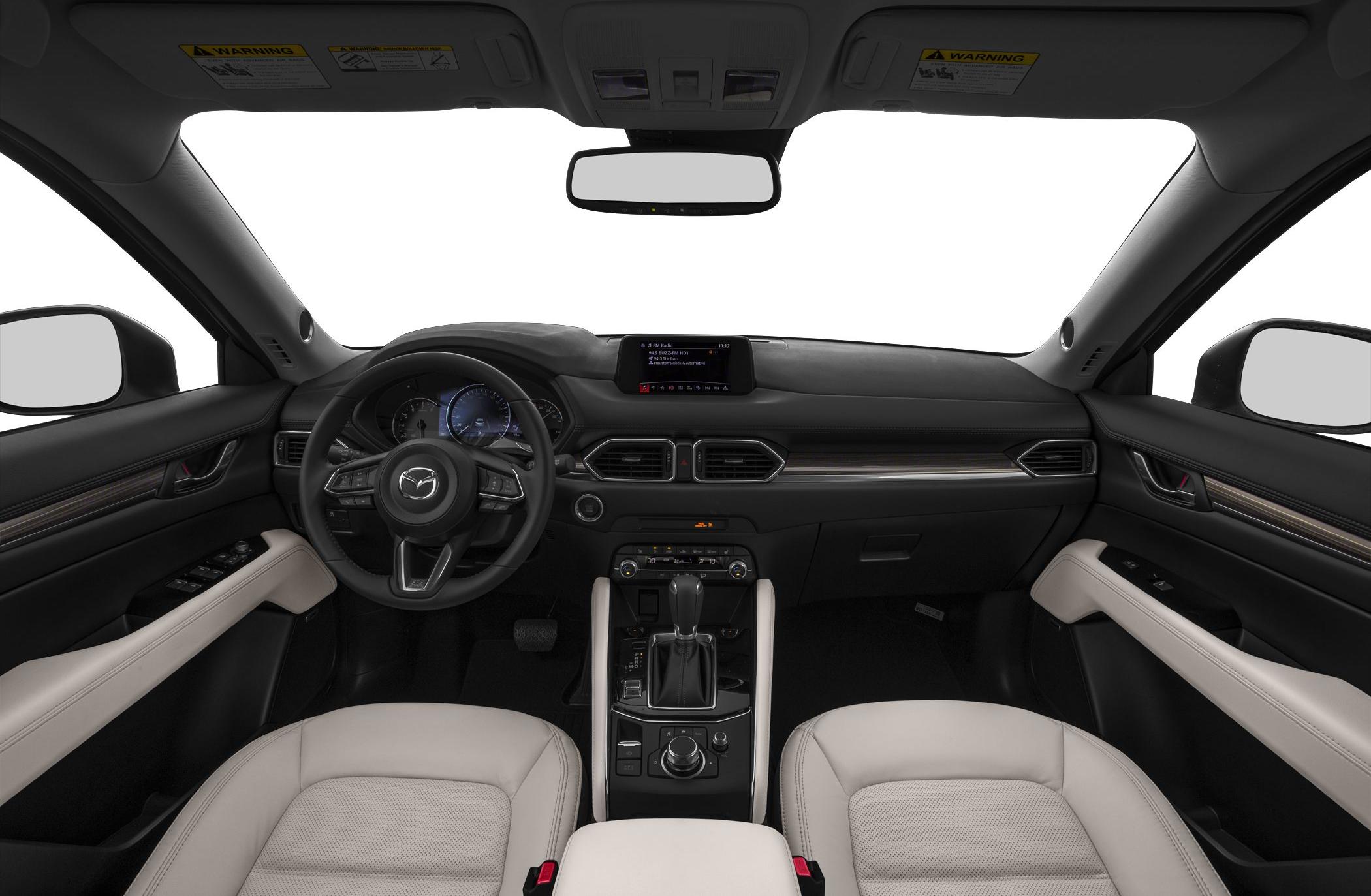 Dashboard, steering wheel, and center console interior view with two-tone seats.