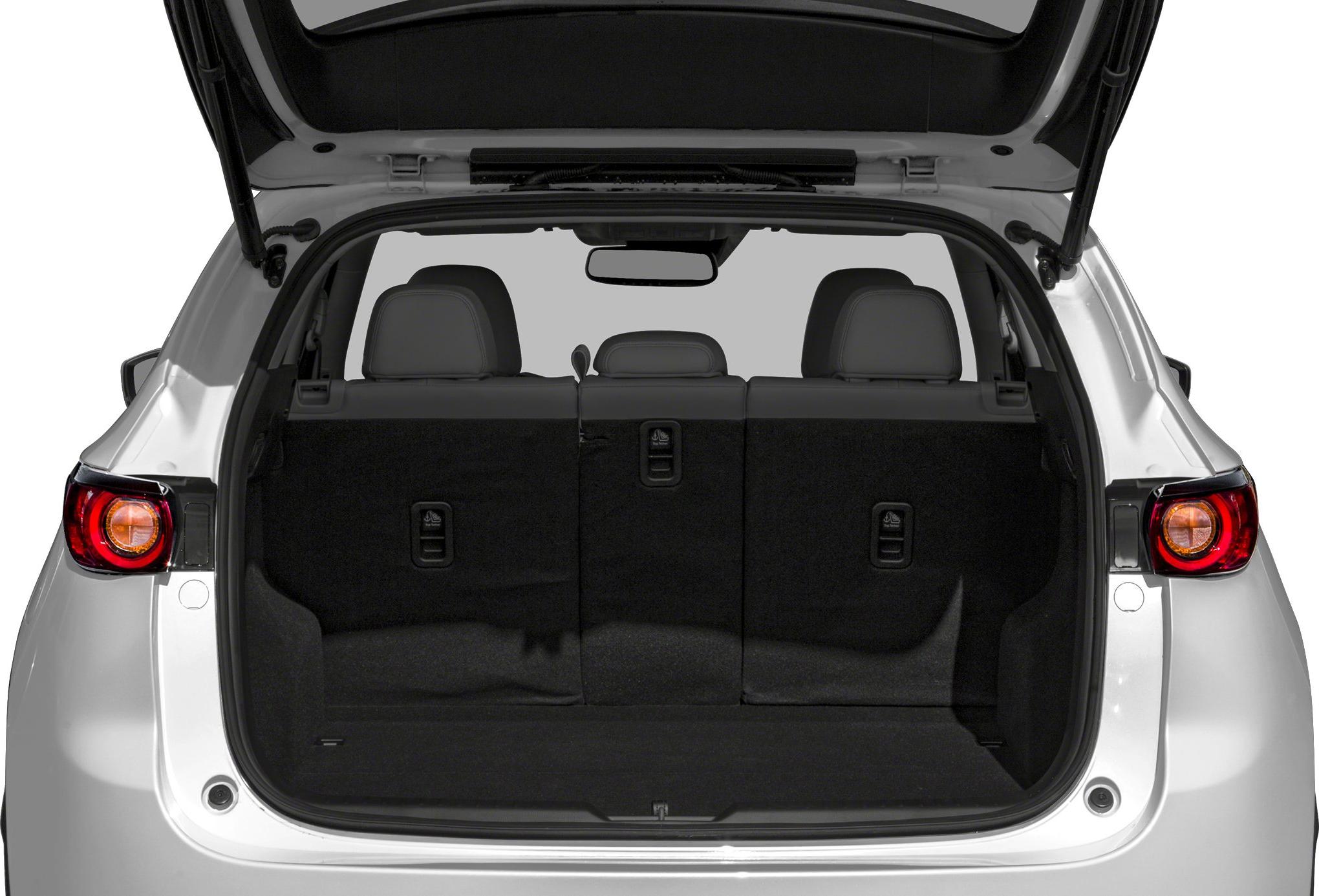 Spacious rear cargo area with foldable seats inside an SUV.