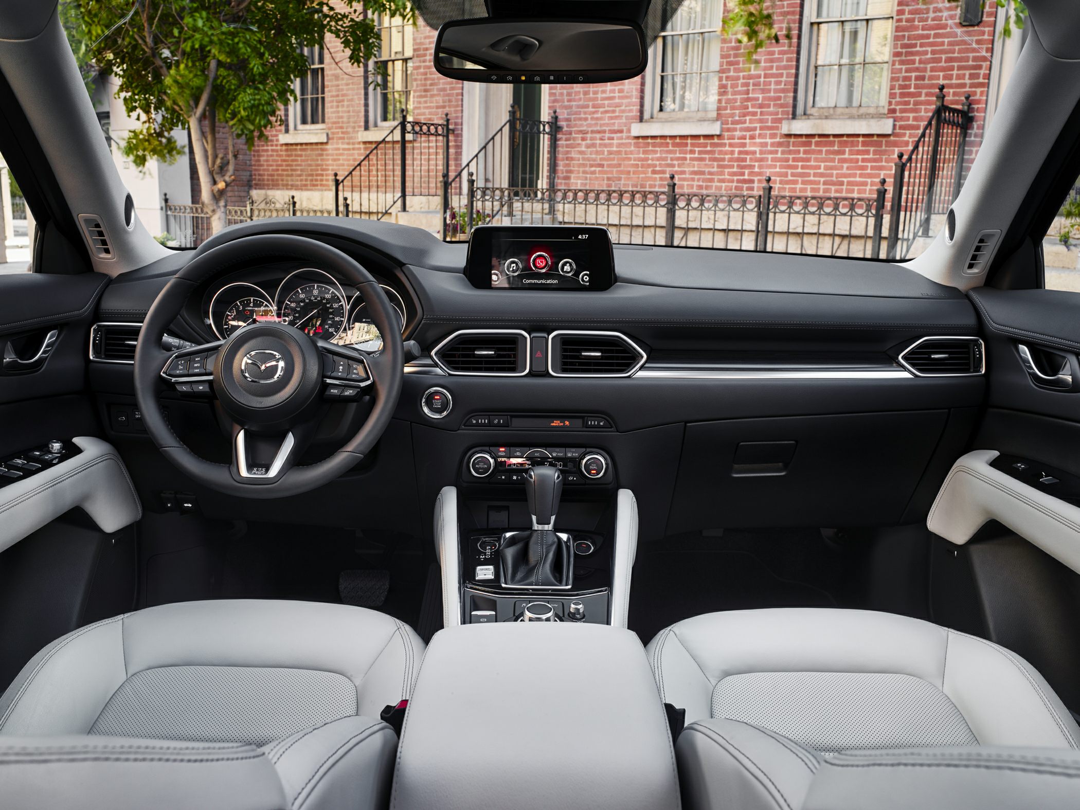 Modern dashboard, steering wheel, infotainment screen, and center console