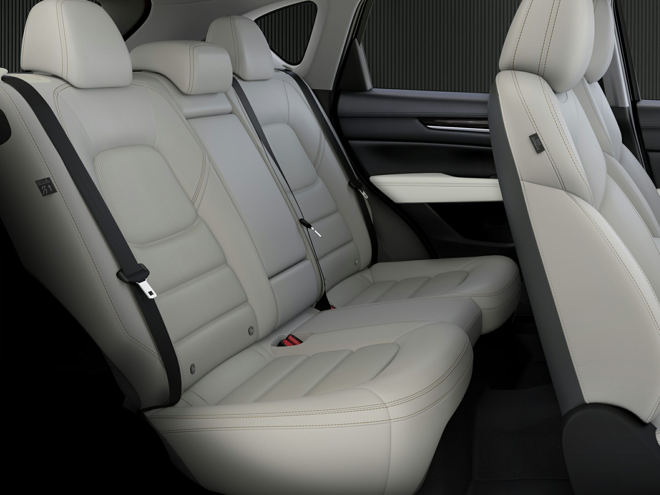 Rear leather seats with seat belts and headrests in a spacious vehicle interior