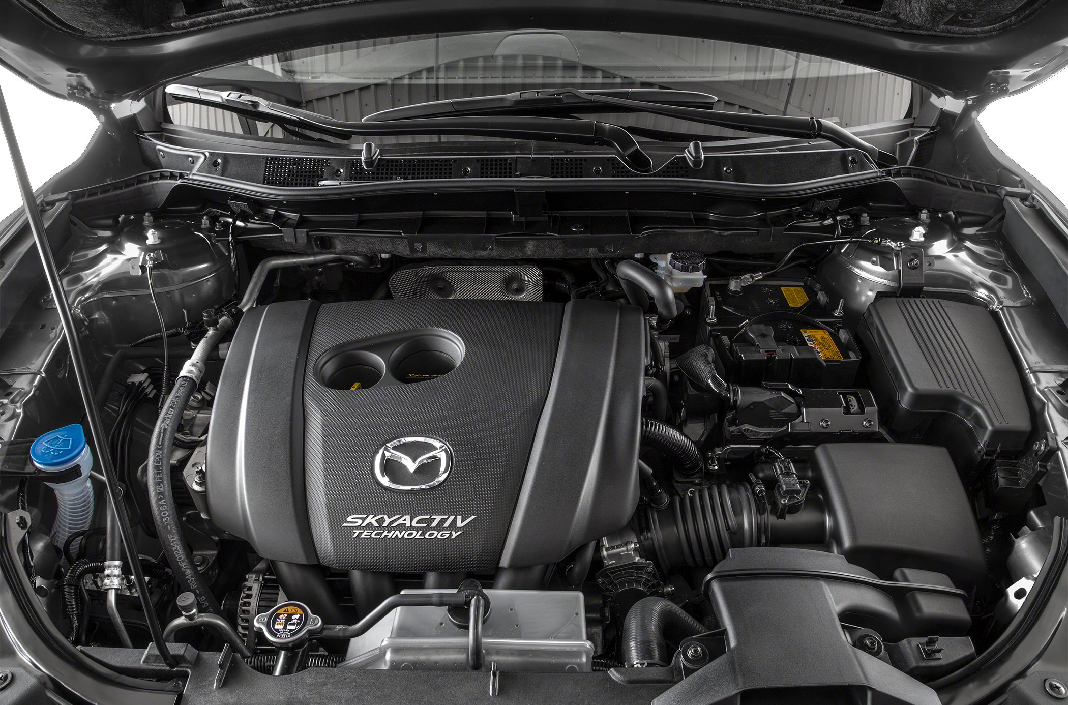 Mazda engine bay featuring SKYACTIV technology cover and components
