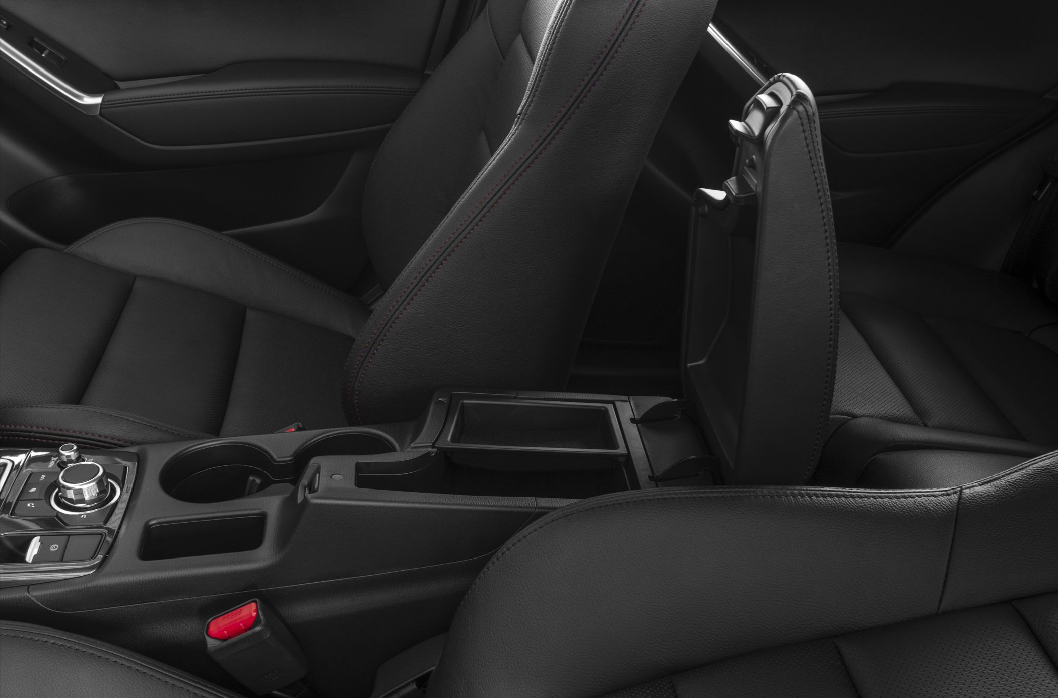 Center console with open storage and black leather seats