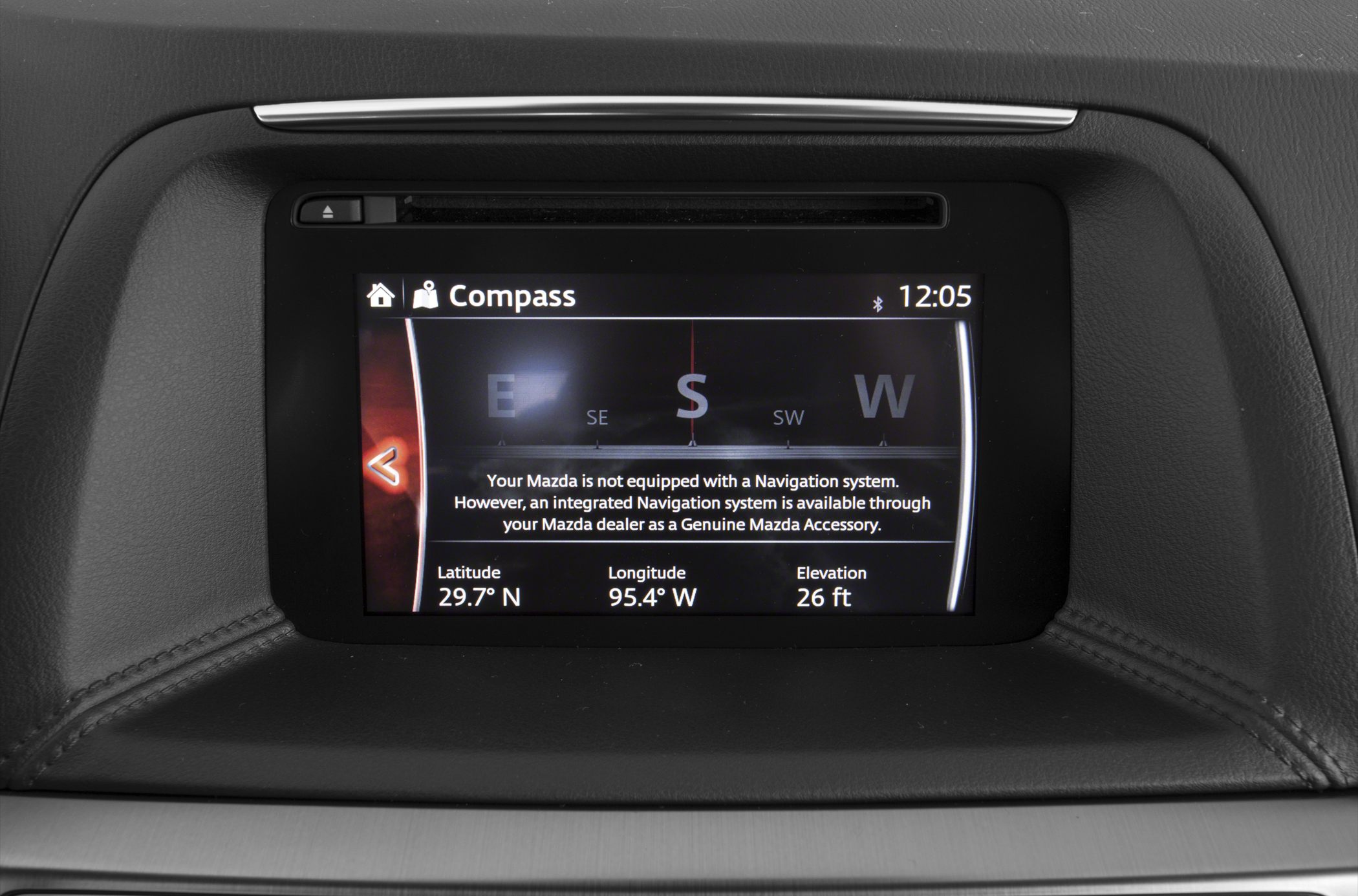 Car infotainment compass screen showing direction and coordinates