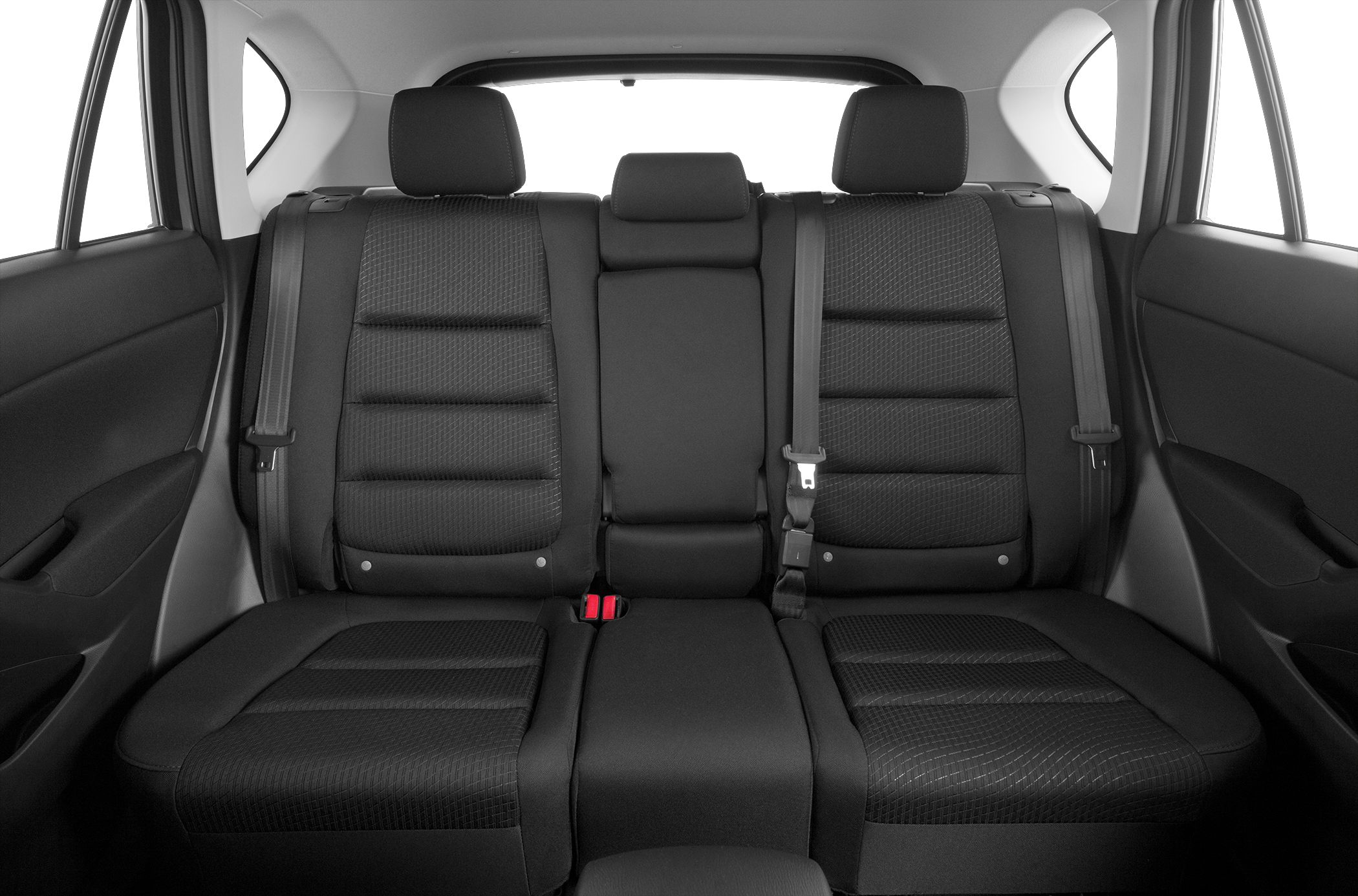 Rear seat upholstery with headrests, seat belts, and textured fabric seating.