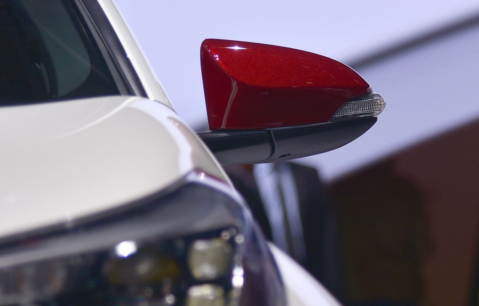 Red side mirror with integrated turn signal indicator