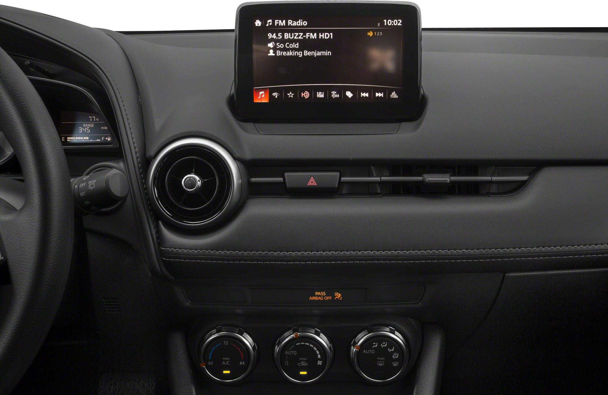 Center console with infotainment screen and climate control dials