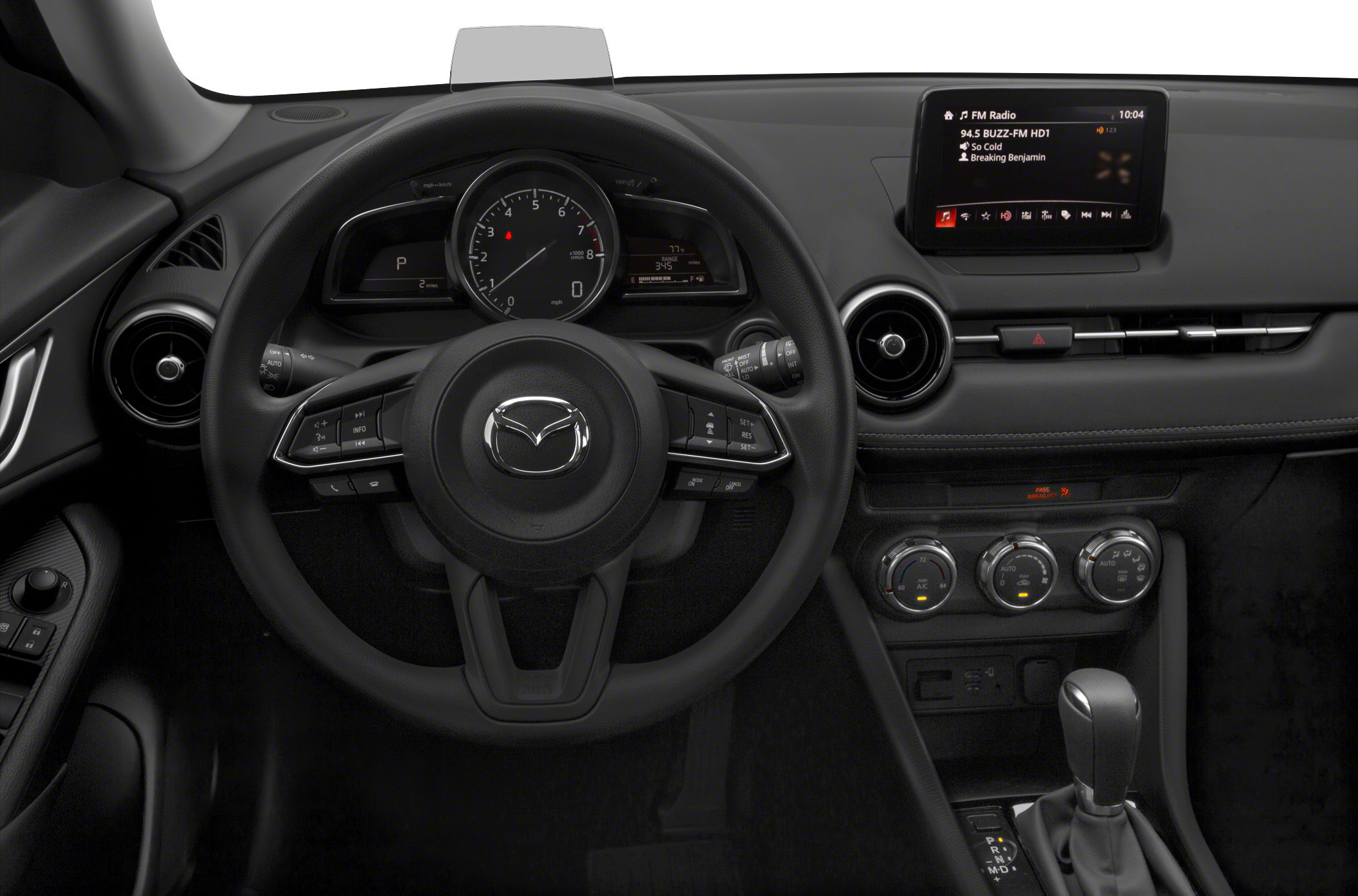 Steering wheel, dashboard, and infotainment display inside a vehicle