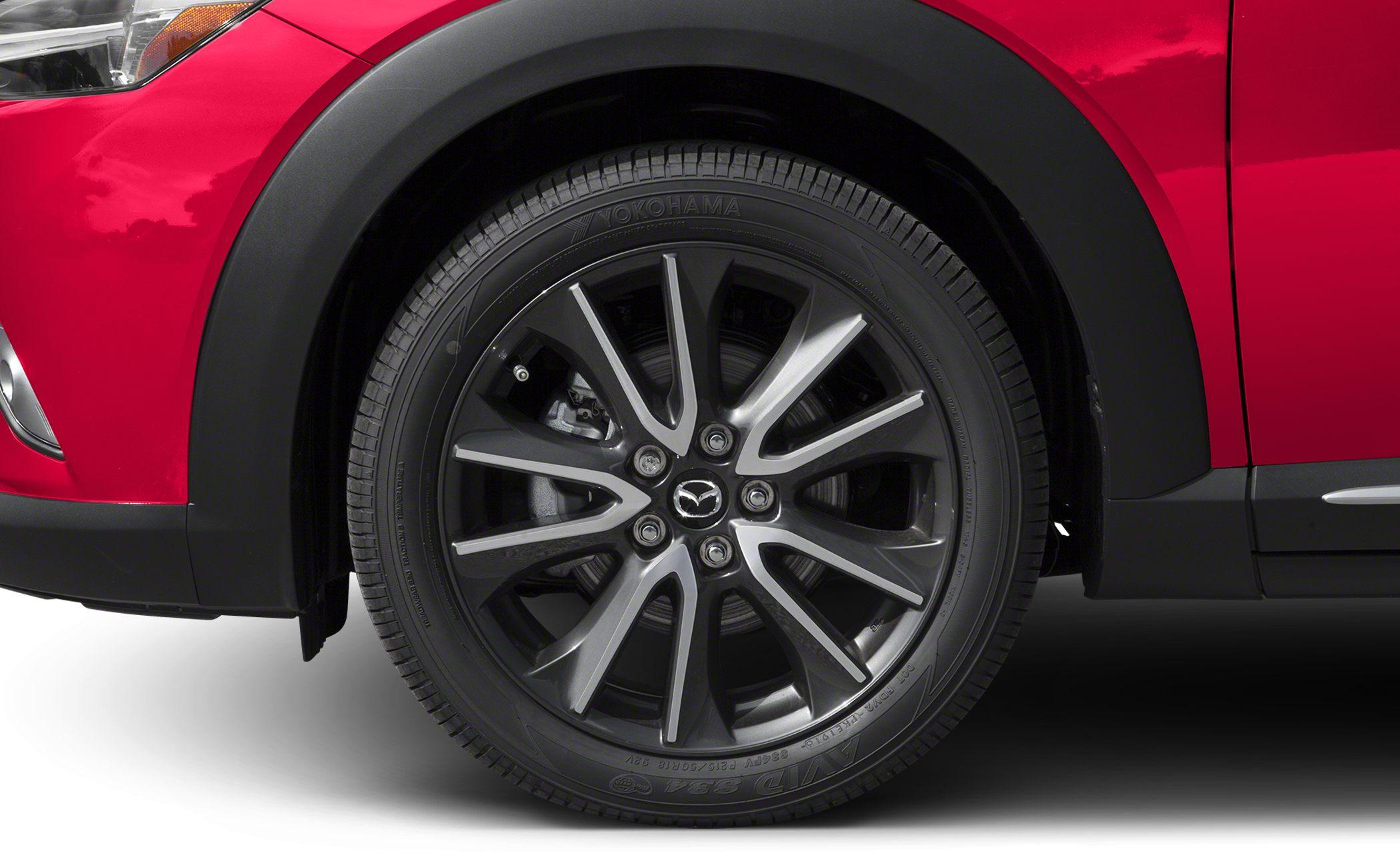 Close-up of alloy wheel and tire with detailed rim design