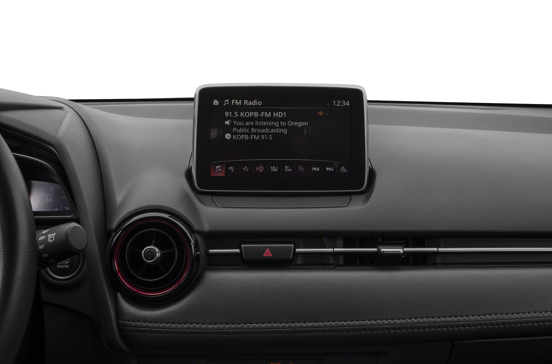 Dashboard with infotainment screen and circular air vent