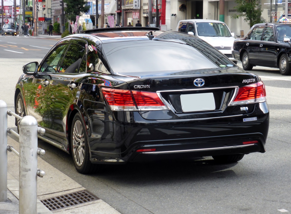 Rear view of a luxury sedan with distinct taillights and chrome detailing