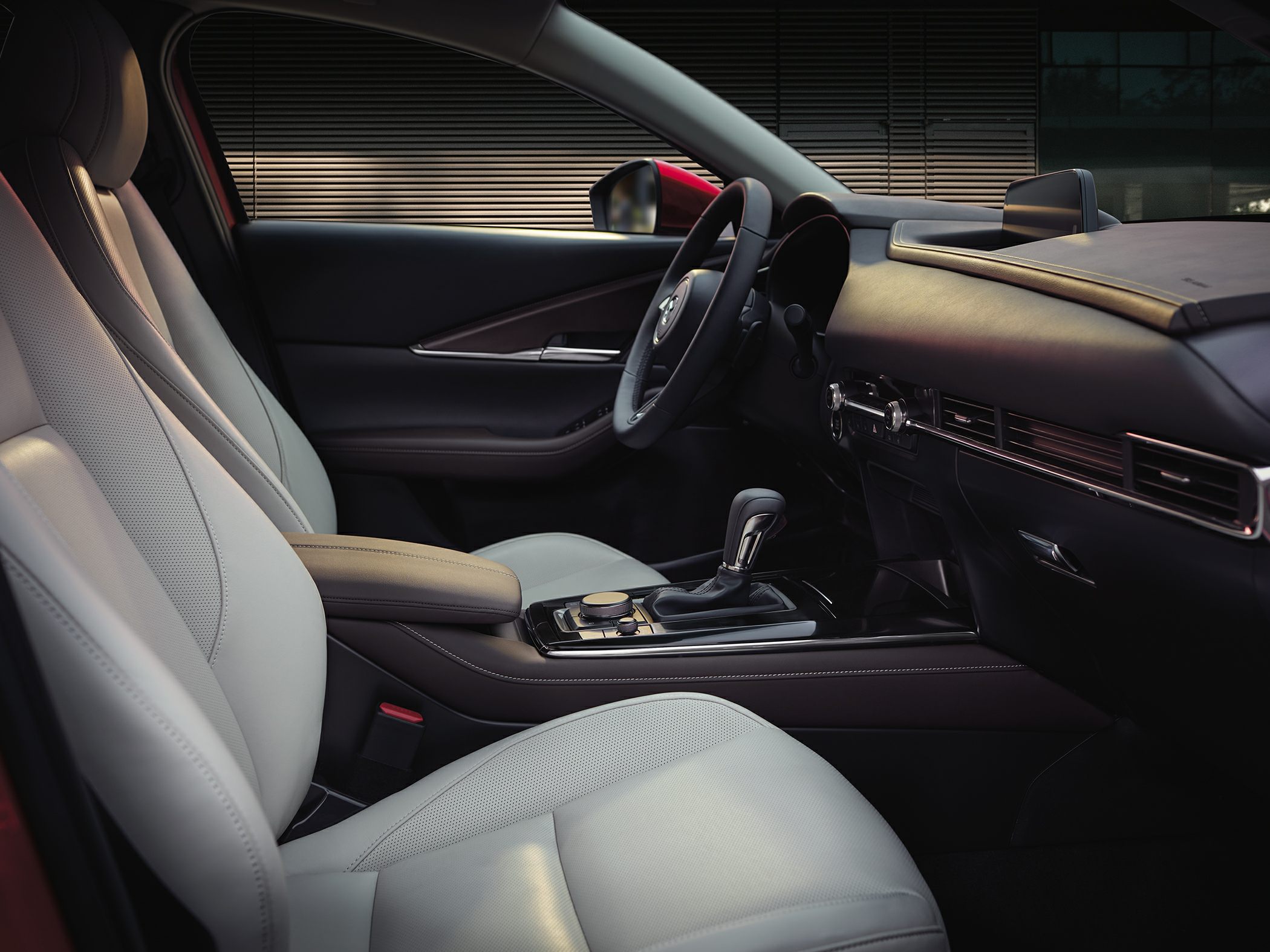 Premium light leather seats and modern dashboard with center console.